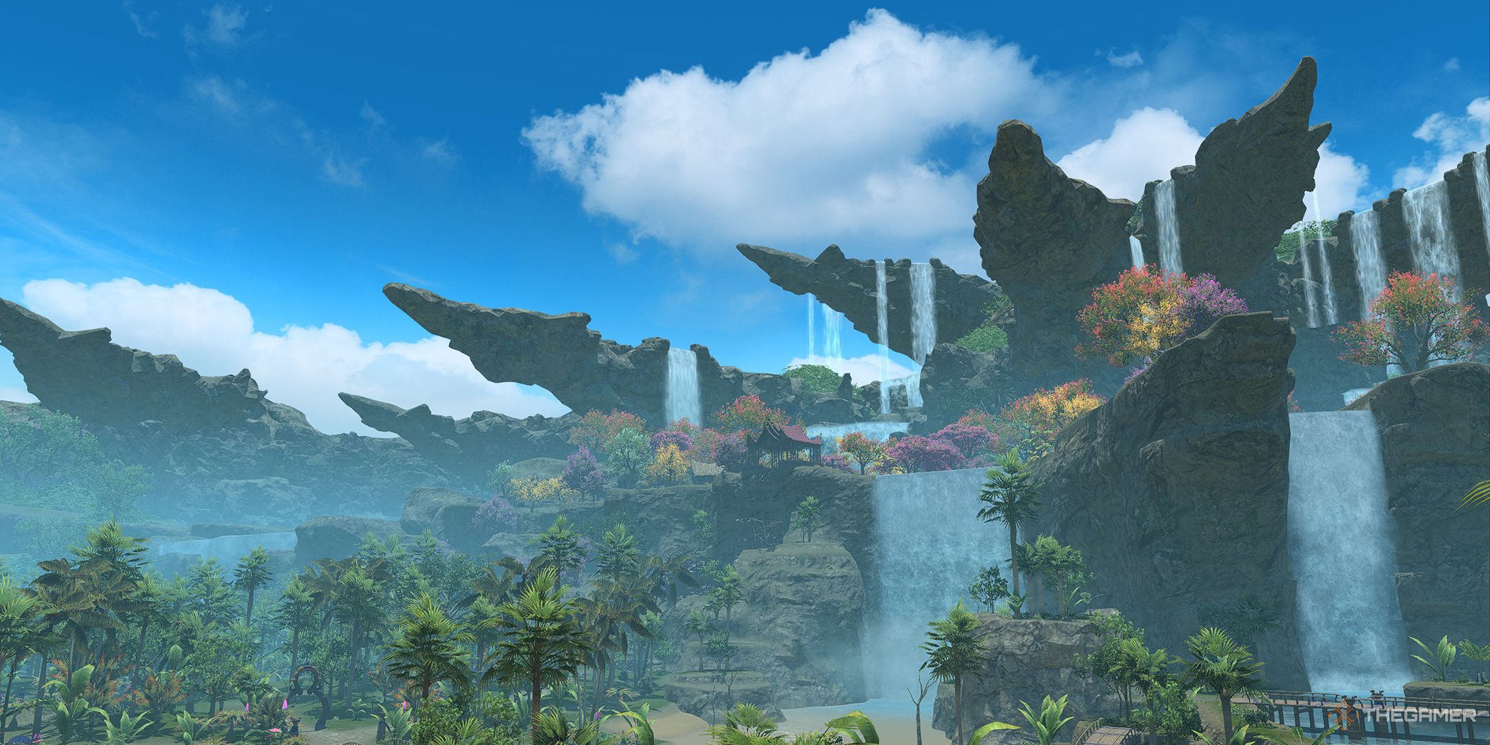 The peaks and waterfalls of Kozama'uka during the day in Final Fantasy 14.