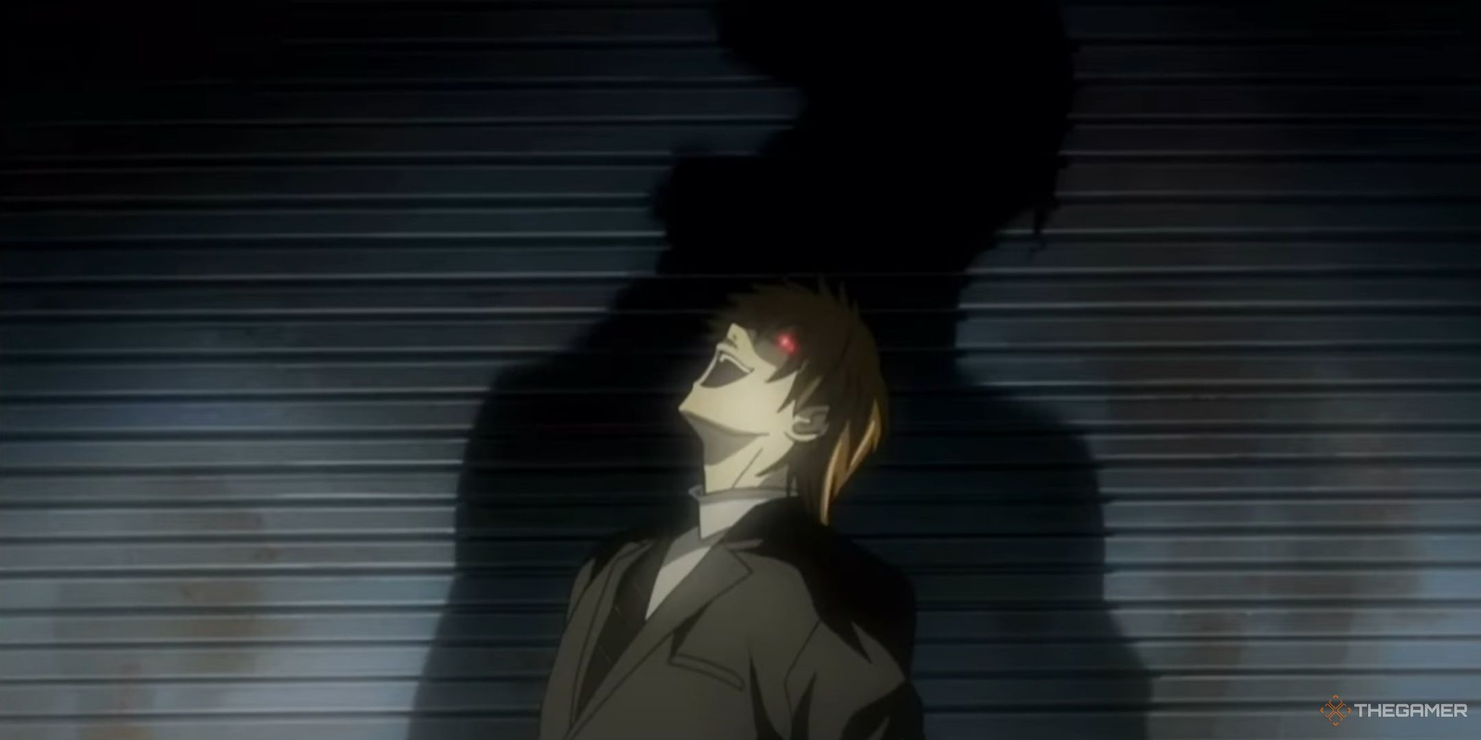 Light Yagami laughs as his identity as Kira is revealed.