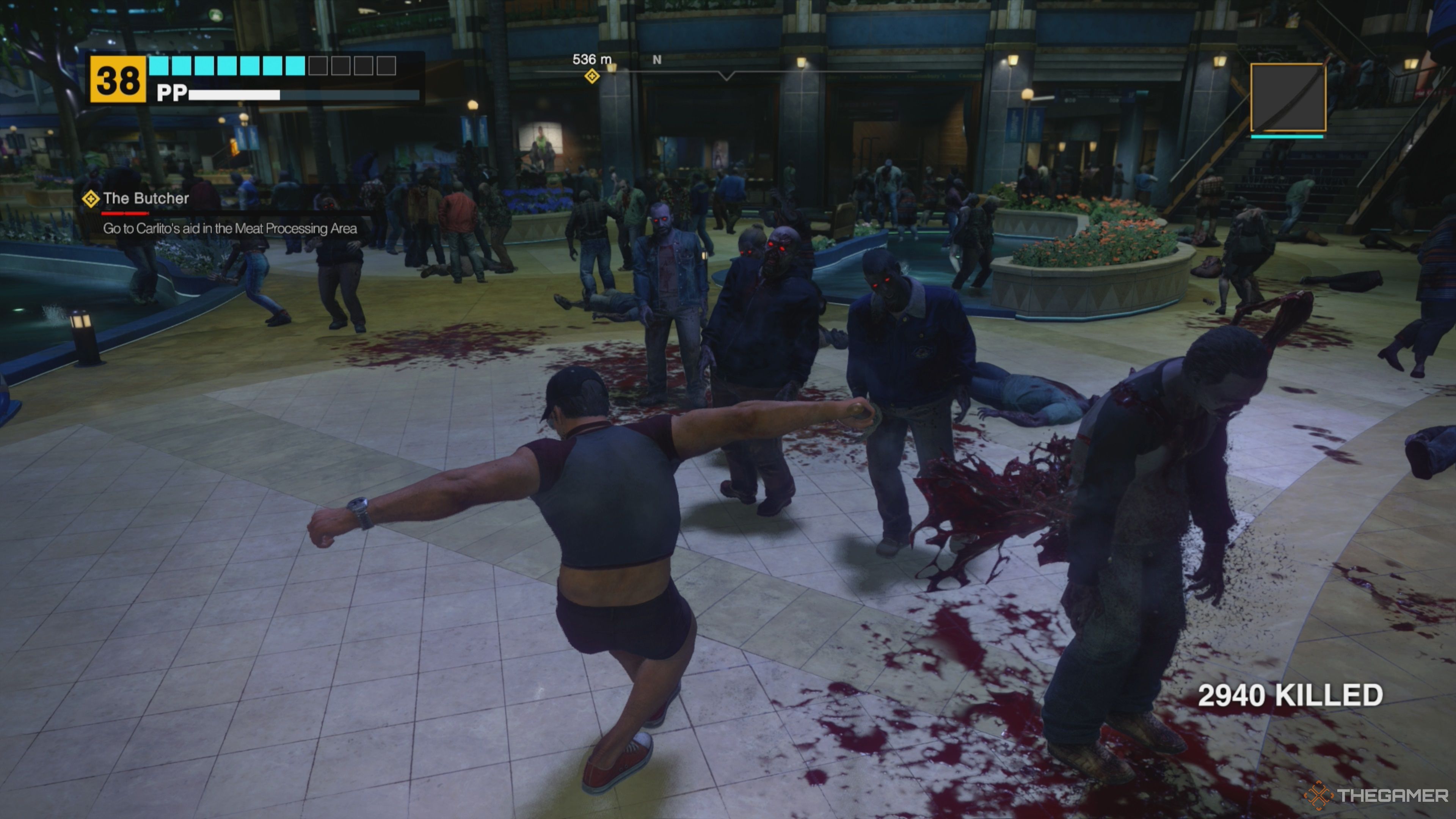 Frank West performing a Double Lariat attack while wielding a Katana, slicing through zombies while violently twirling in Dead Rising Deluxe Remaster.
