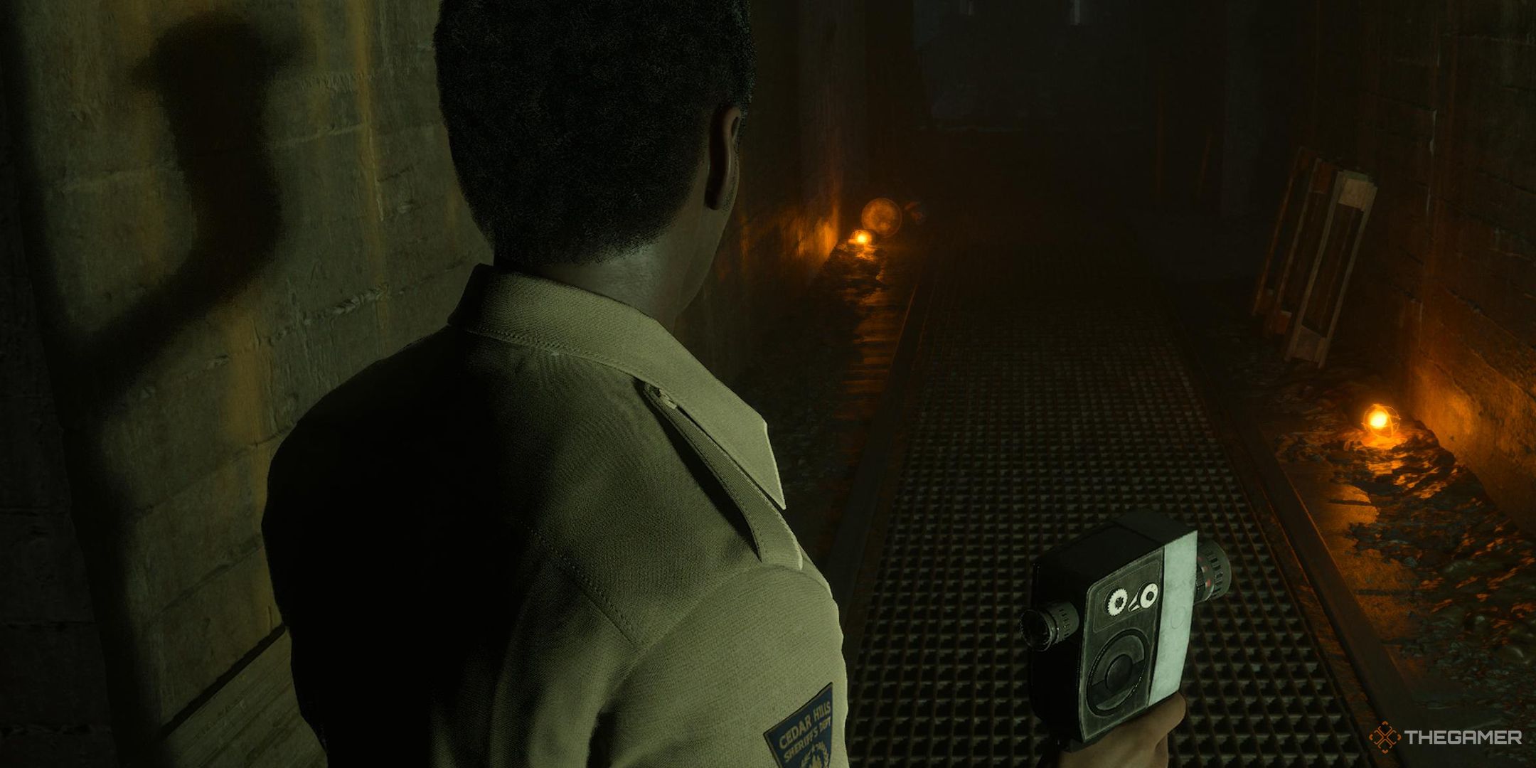 The Casting of Frank Stone police officer Sam Green exploring an underground tunnel with a camera