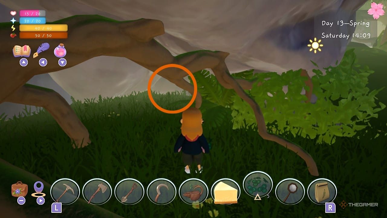 Player under a branch in a cave in in Garden Witch Life.