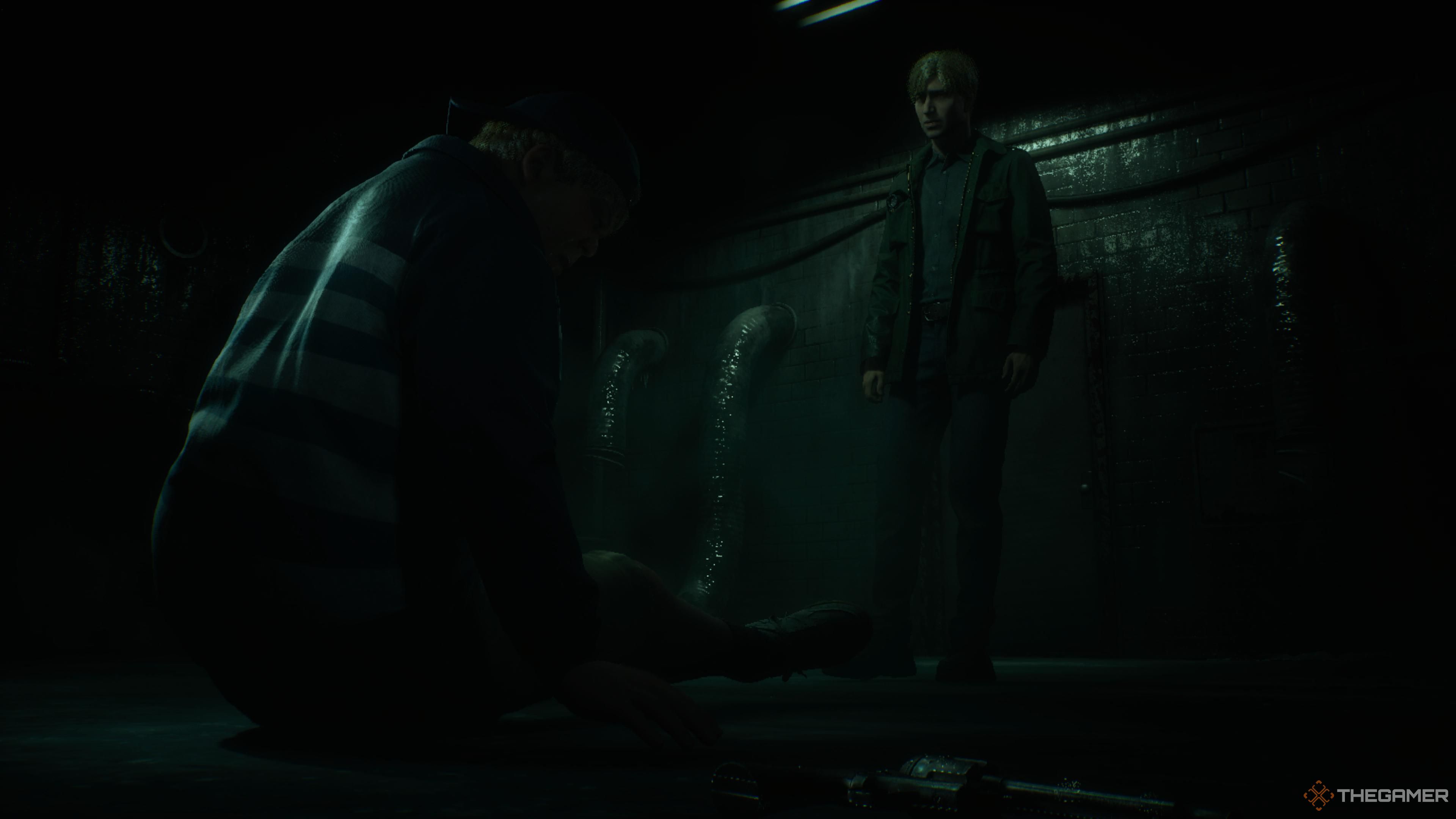 James looking at Eddie after punching him as he he sits on the floor in silent hill 2 remake.