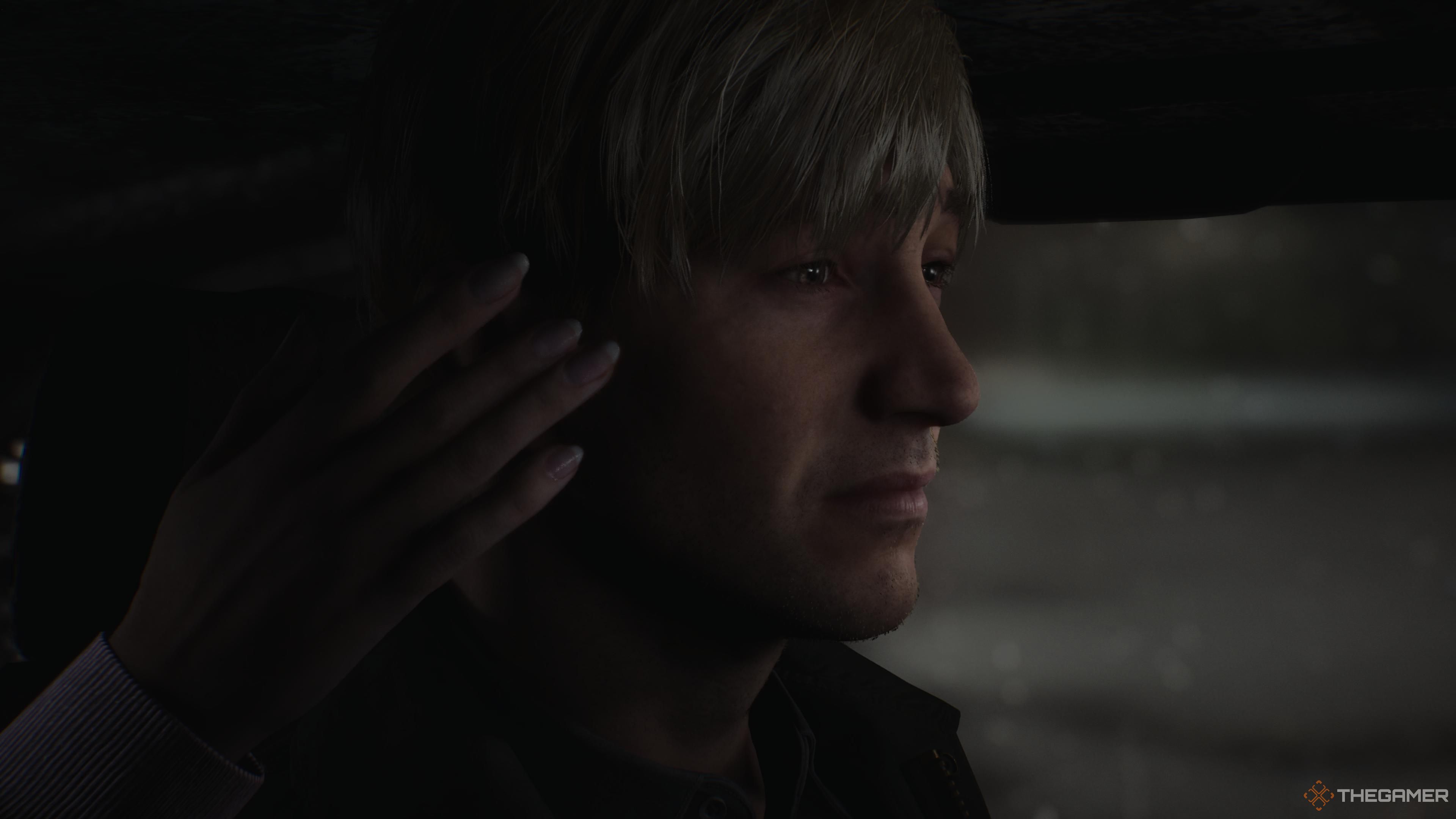 Mary's hand reaching out to caress James' cheek in the Stillness ending of Silent Hill 2 remake.