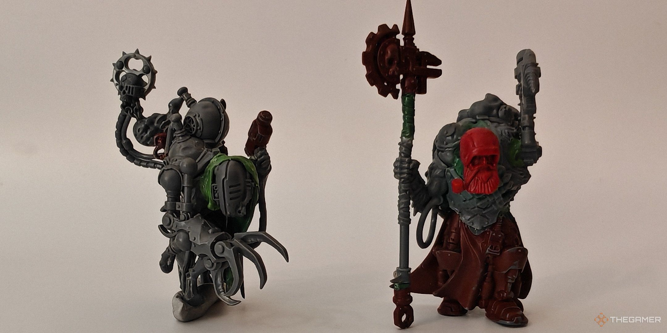 Two Warhammer 40K Adeptus Mechanicus models converted from Skaven units