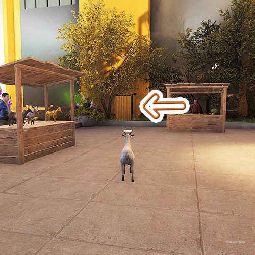 An orange arrow points the trophy that is inside the metal shed next to hotel&rsquo;s wall in Goat Simulator Remastered