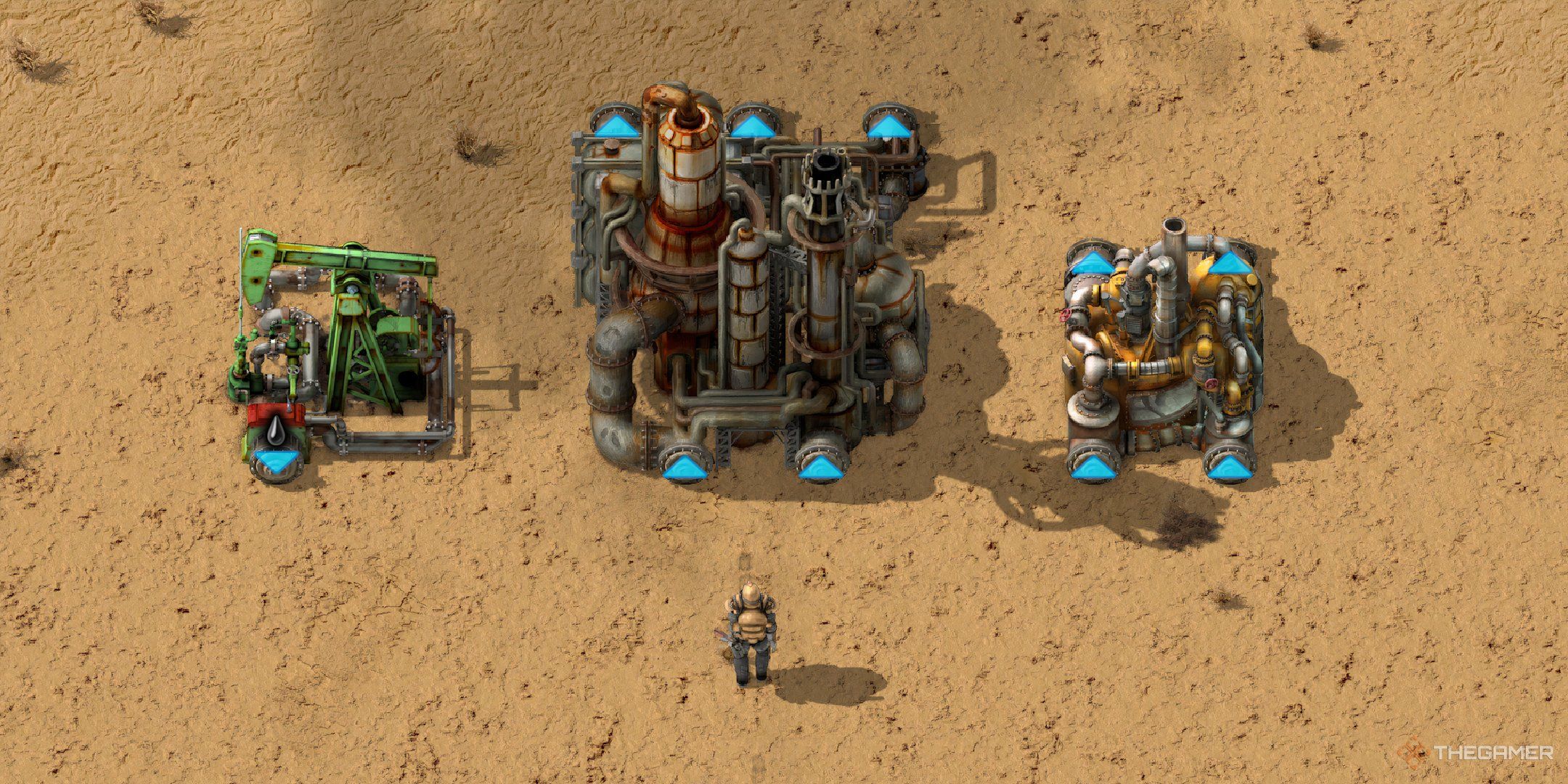 A player standing in front of the buildings required to refine oil in sequence, in Factorio.