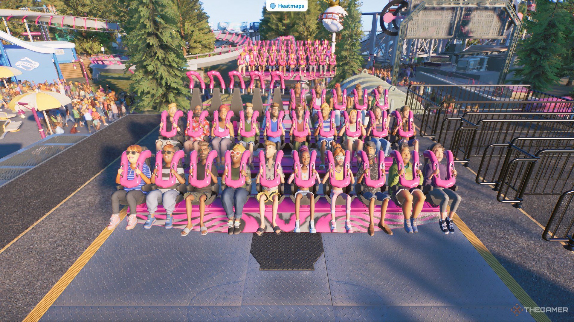 Guests seated on a floorless coaster waiting to start.