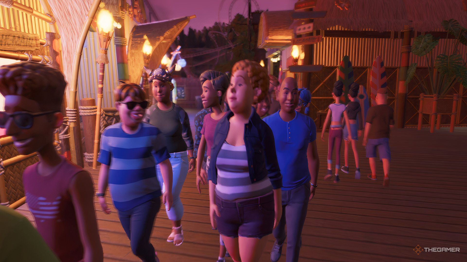 Guests walking through the park at night.