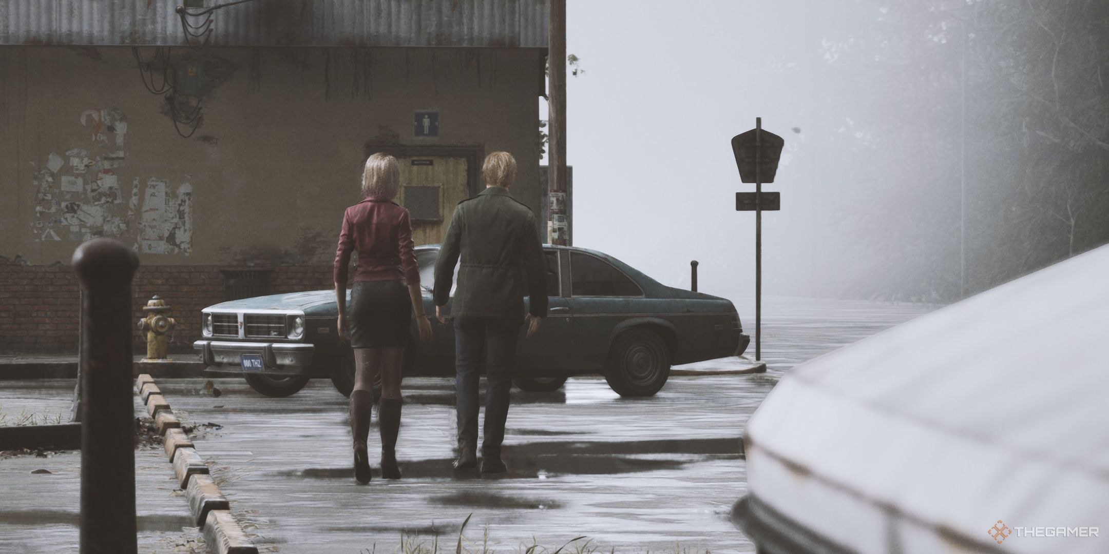 Silent Hill 2 Remake screenshot of the Mary ending, showing James and Mary walking towards his car at the entrance of town by the bathroom.