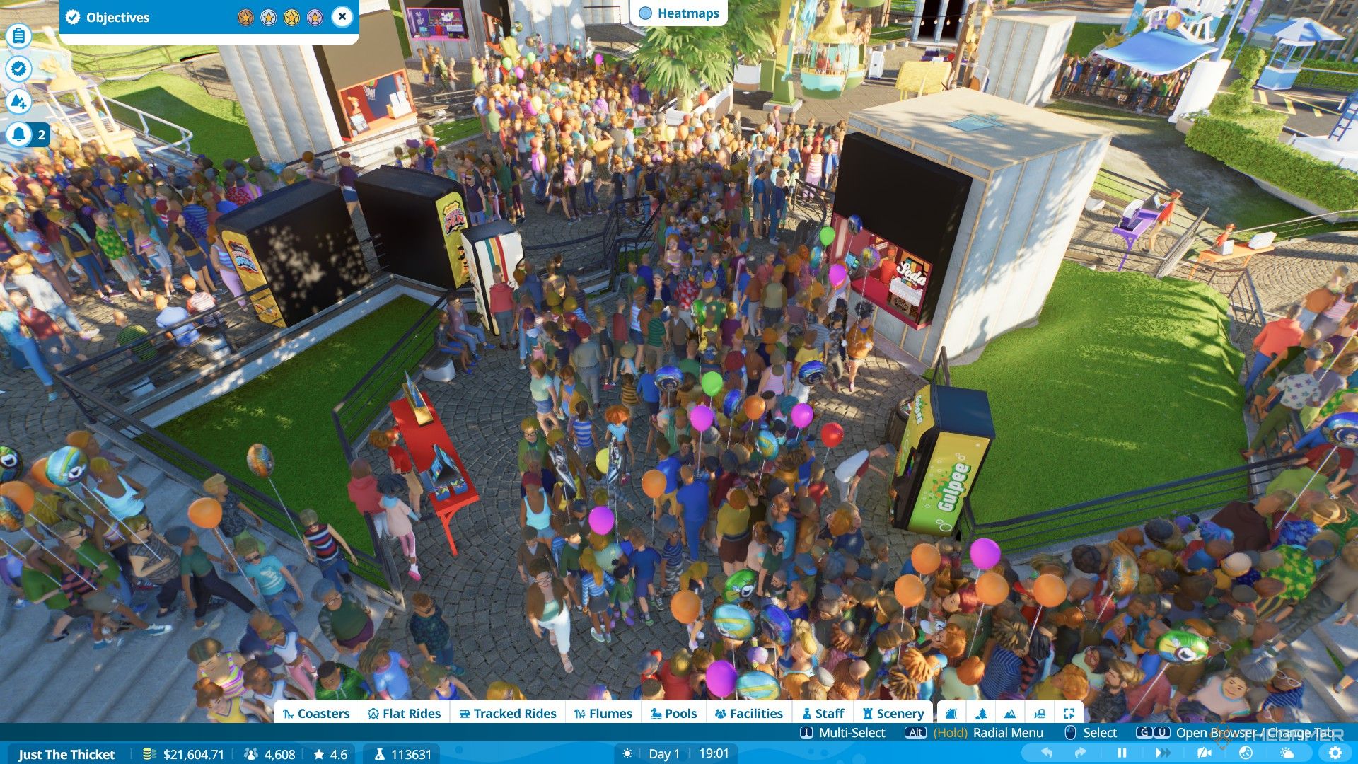 مهمانان در یک مسیر شلوغ در Planet Coaster 2 حرکت می کنند.