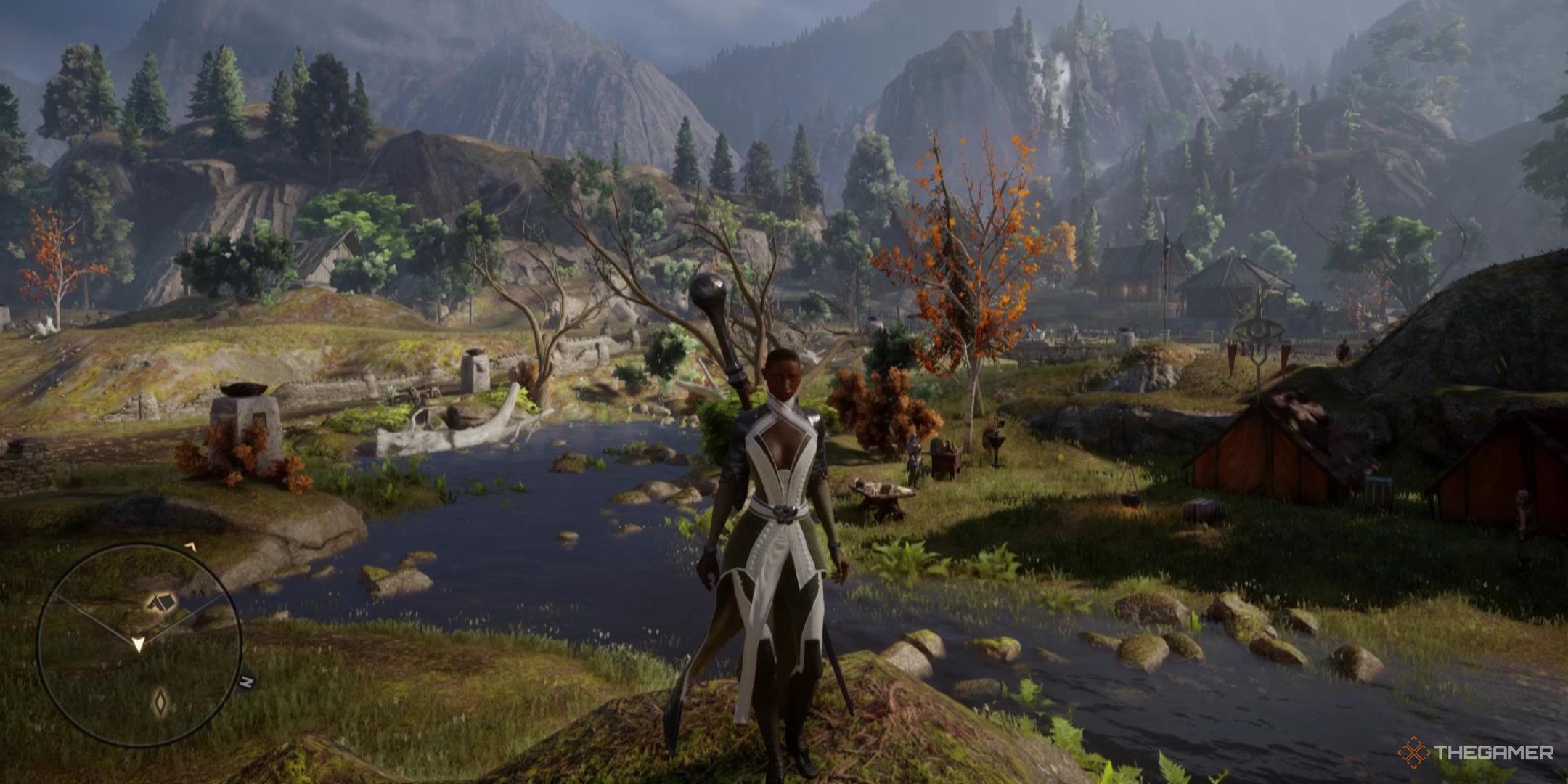 Vivienne stands in front of an idyllic, green background of grass, trees, and mountains in Dragon Age: Inquisition.