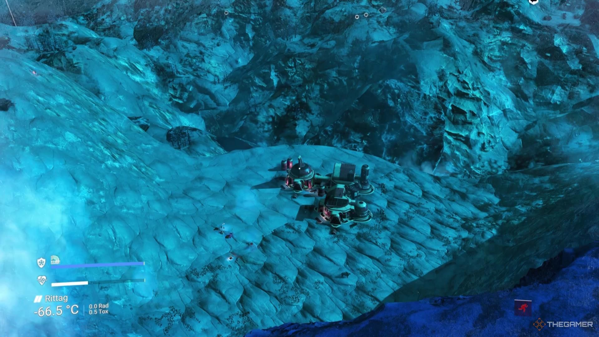 Looking off a large cliff at a facility below in No Man's Sky.