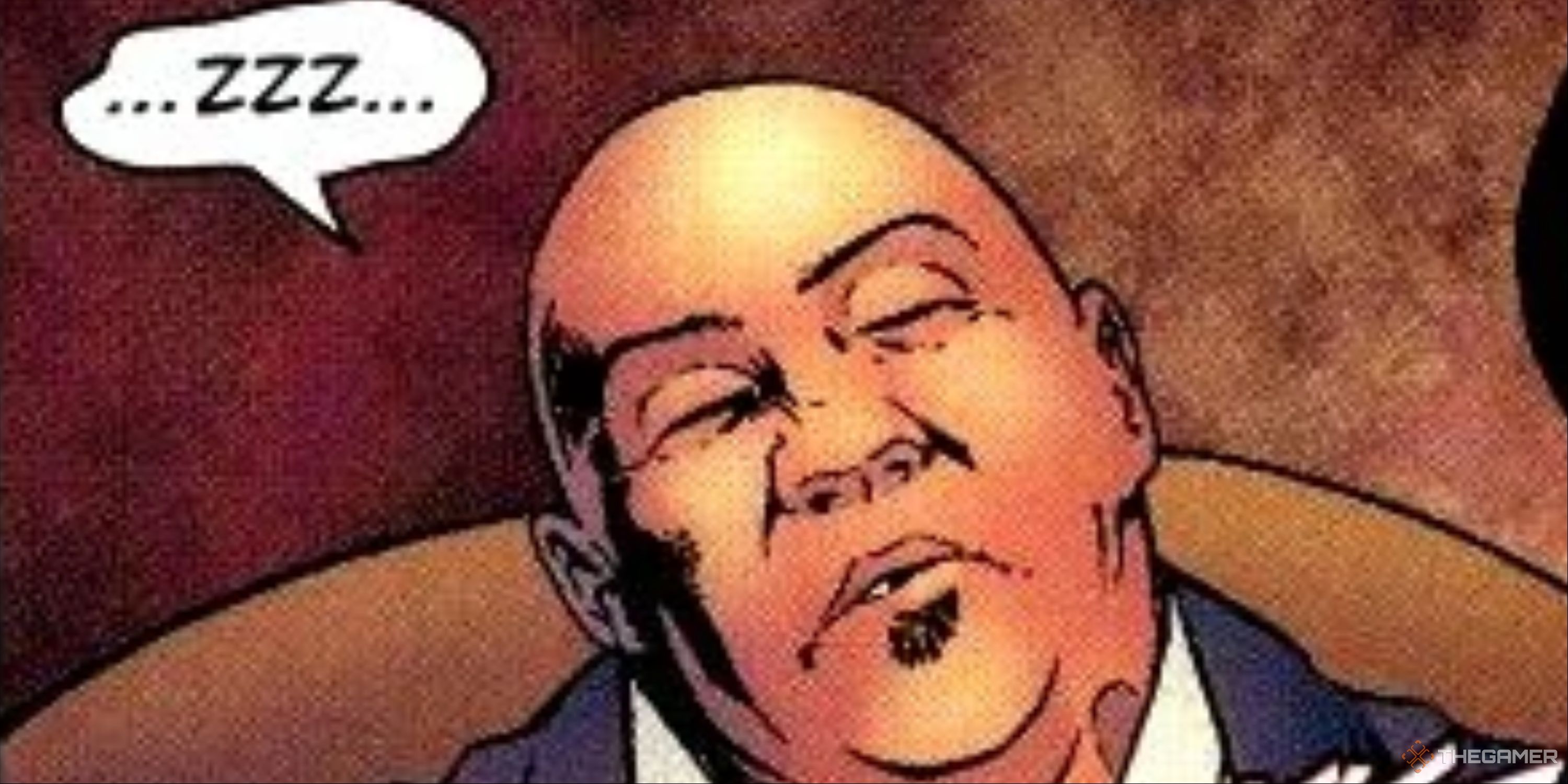 A bald man in a suit who appears to be asleep.