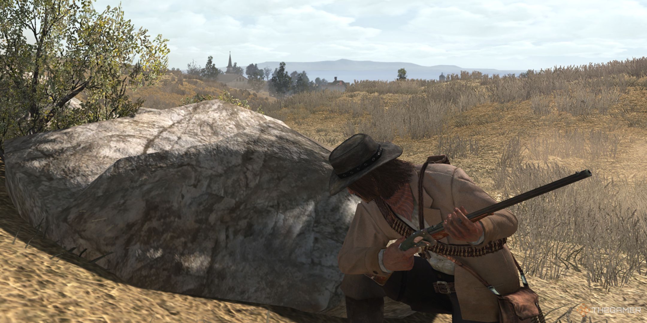 Red Dead Redemption screenshot of protagonist in cover holding an Evans Repeater.