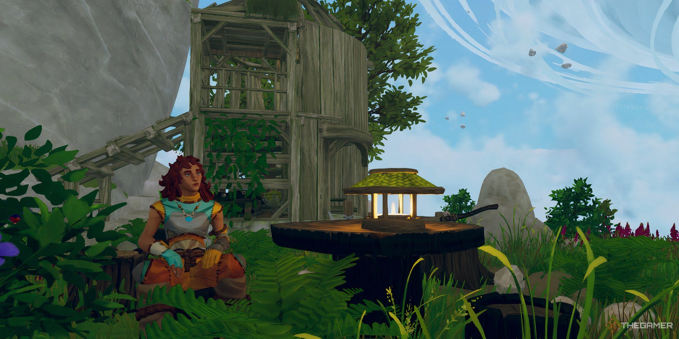 A character in Aloft sitting amid the ruins of a house.