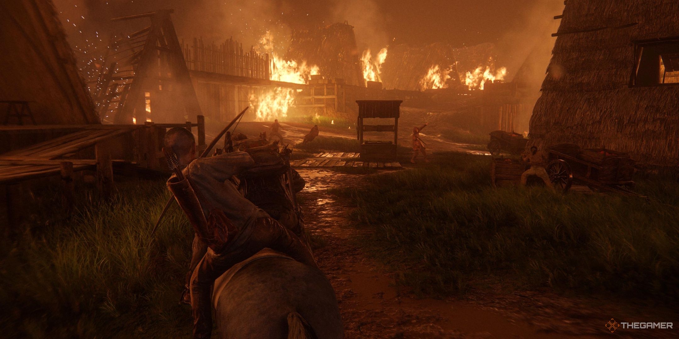 Abby and Lev riding on a horse through a burning down village in The Last of Us Part 2.