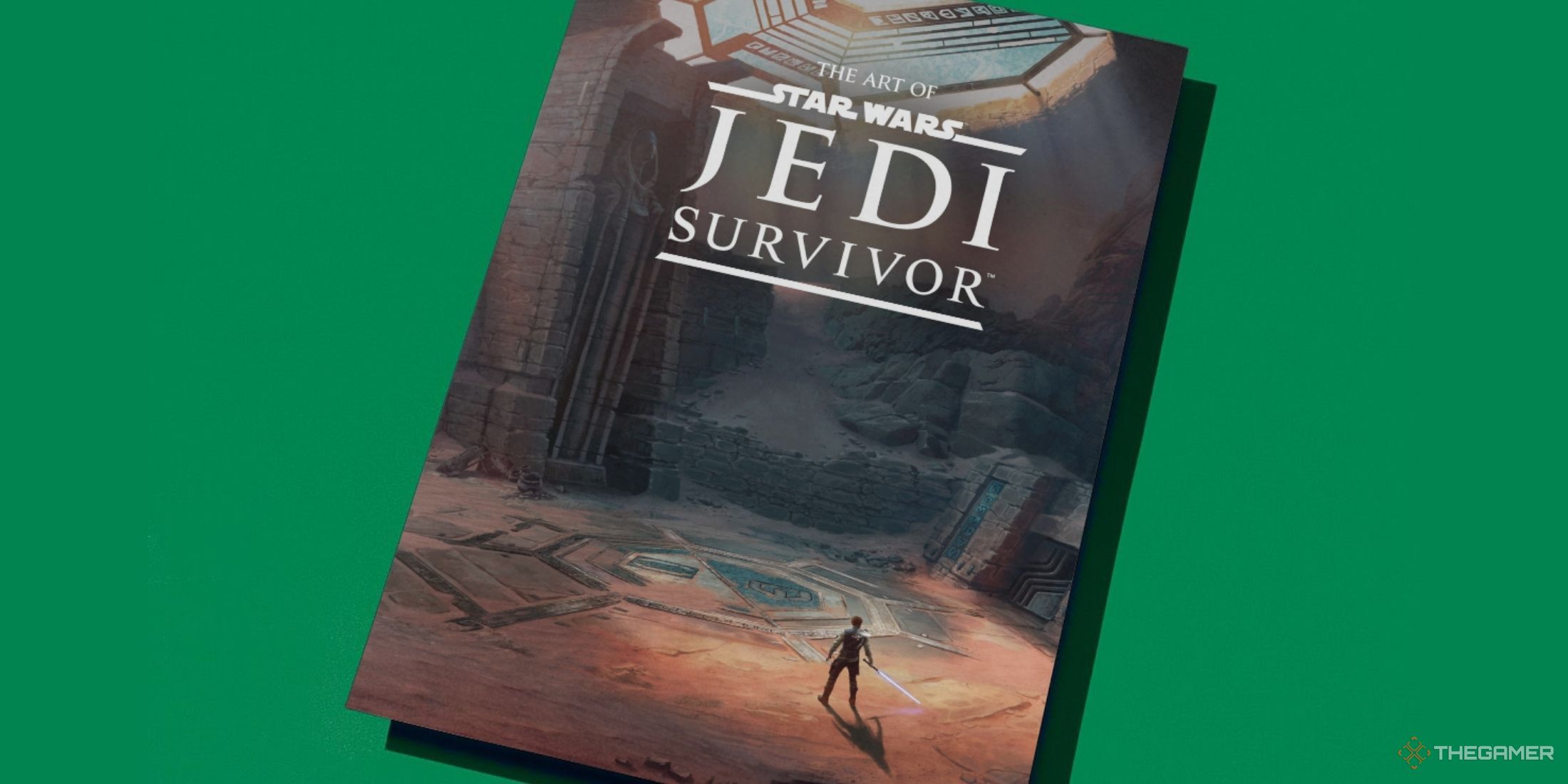 A photo of The Art of Star Wars Jedi Survivor in front of a green background.