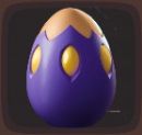 Close up view of a dark purple egg with gold markings in Luma Island.