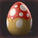 Red egg with white spots and a sandy brown bottom with large white ovals in Luma Island.