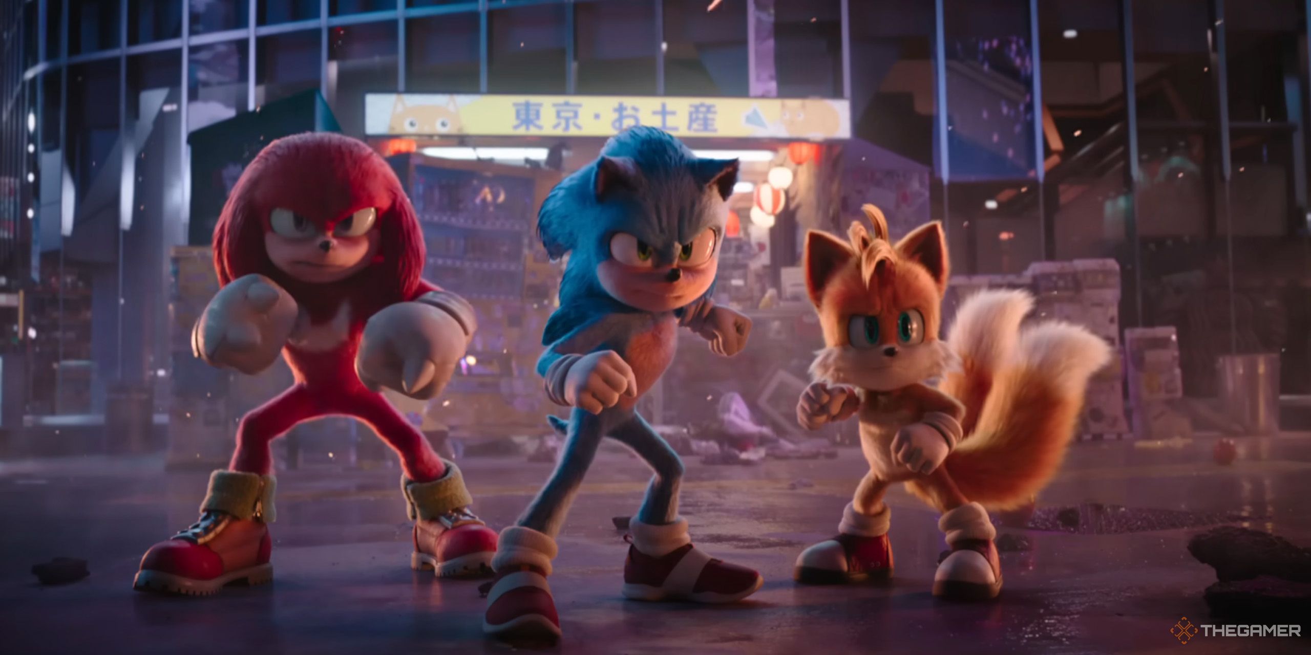 Sonic, Tails, and Knuckles standing in a ruined intersection in Tokyo from Sonic 3 movie.