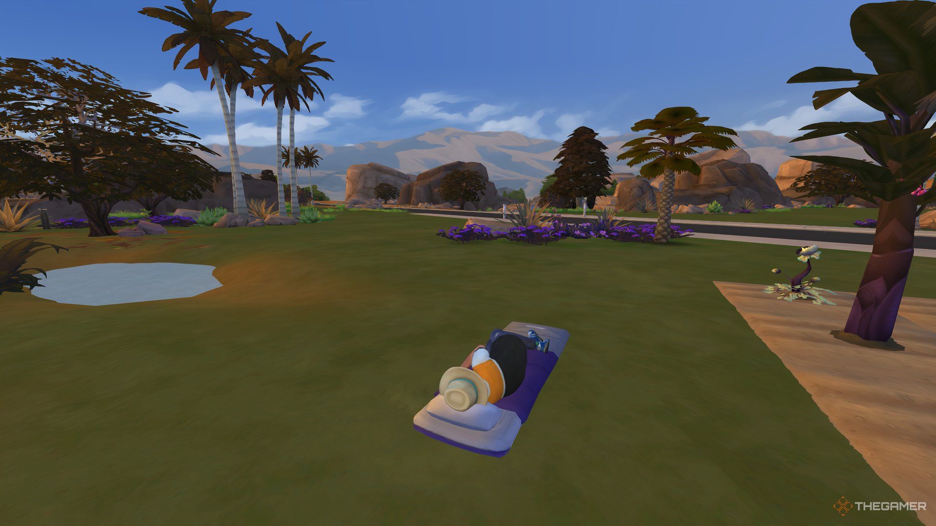 A Sim camping out on a sleeping bag in Oasis Springs.