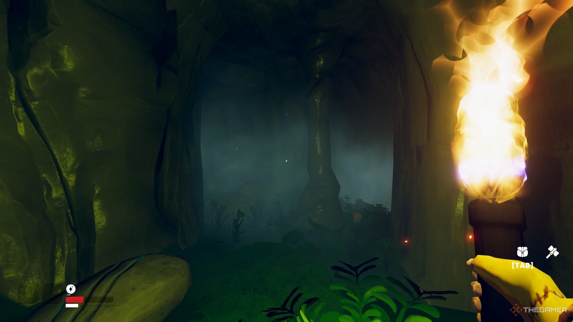 The image shows the player exploring a cave with a torch in hand in Aloft.
