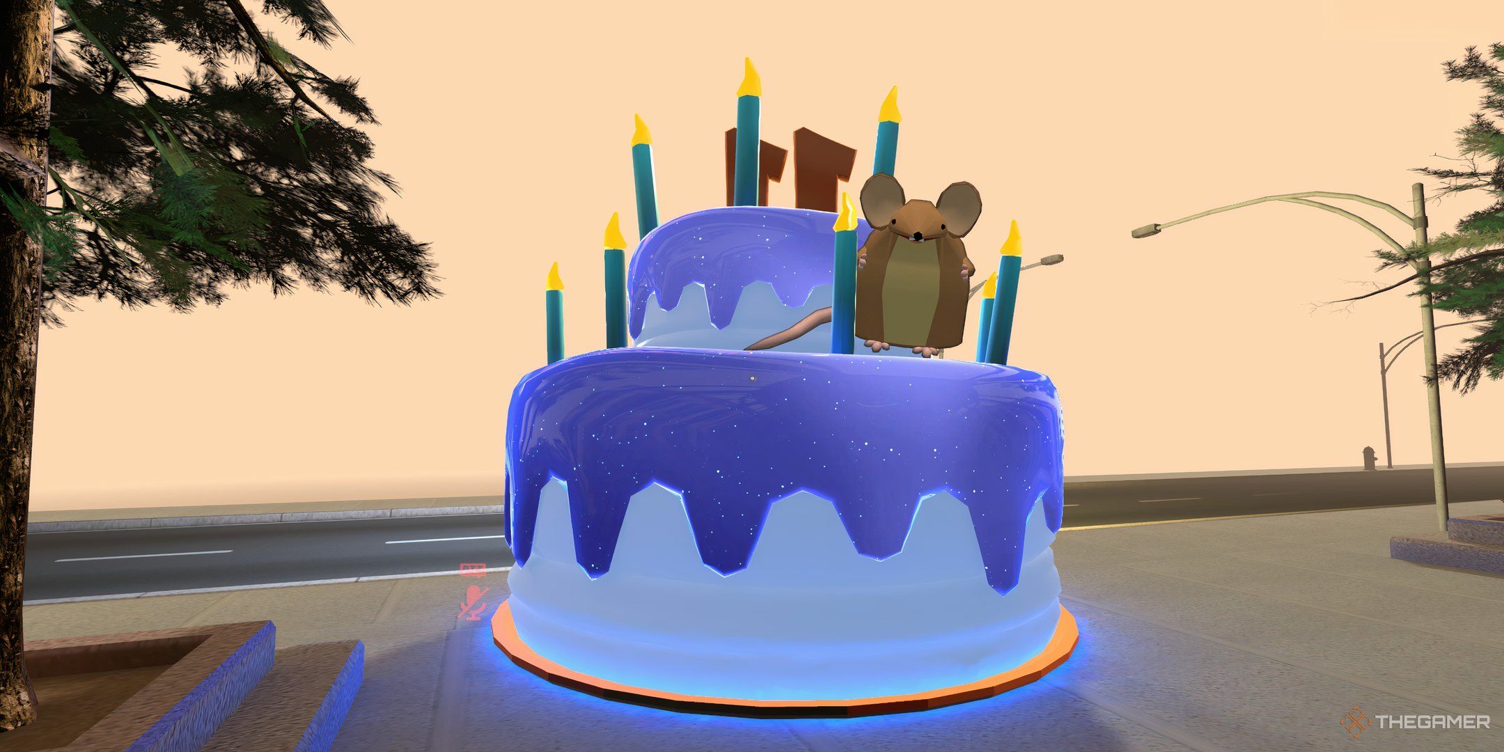 The VRChat mouse sat on a birthday cake in VRChat&rsquo;s original world.