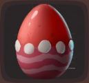 Red egg with a pink stripes on the bottom and large white dots in Luma Island.