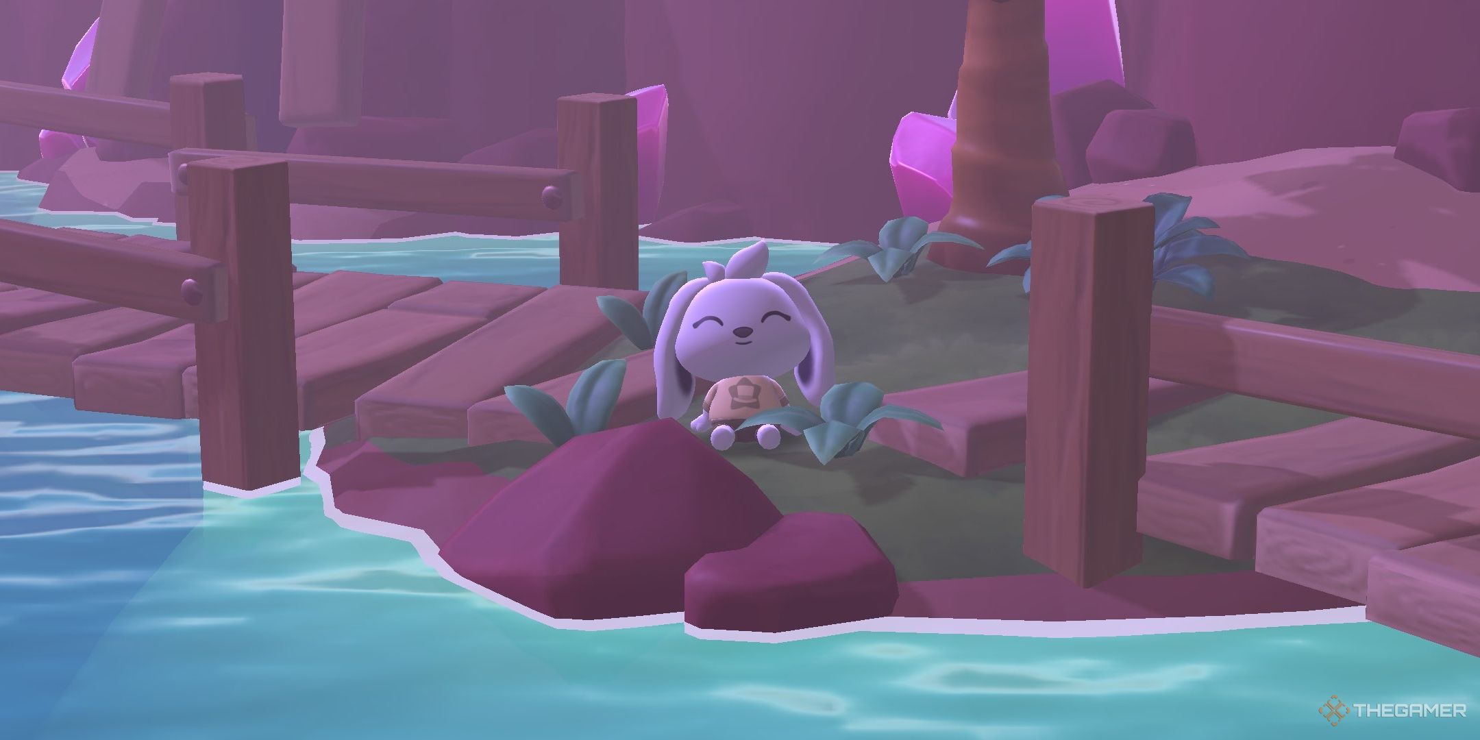 A player sitting near the filled oasis in Hello Kitty Island Adventure.