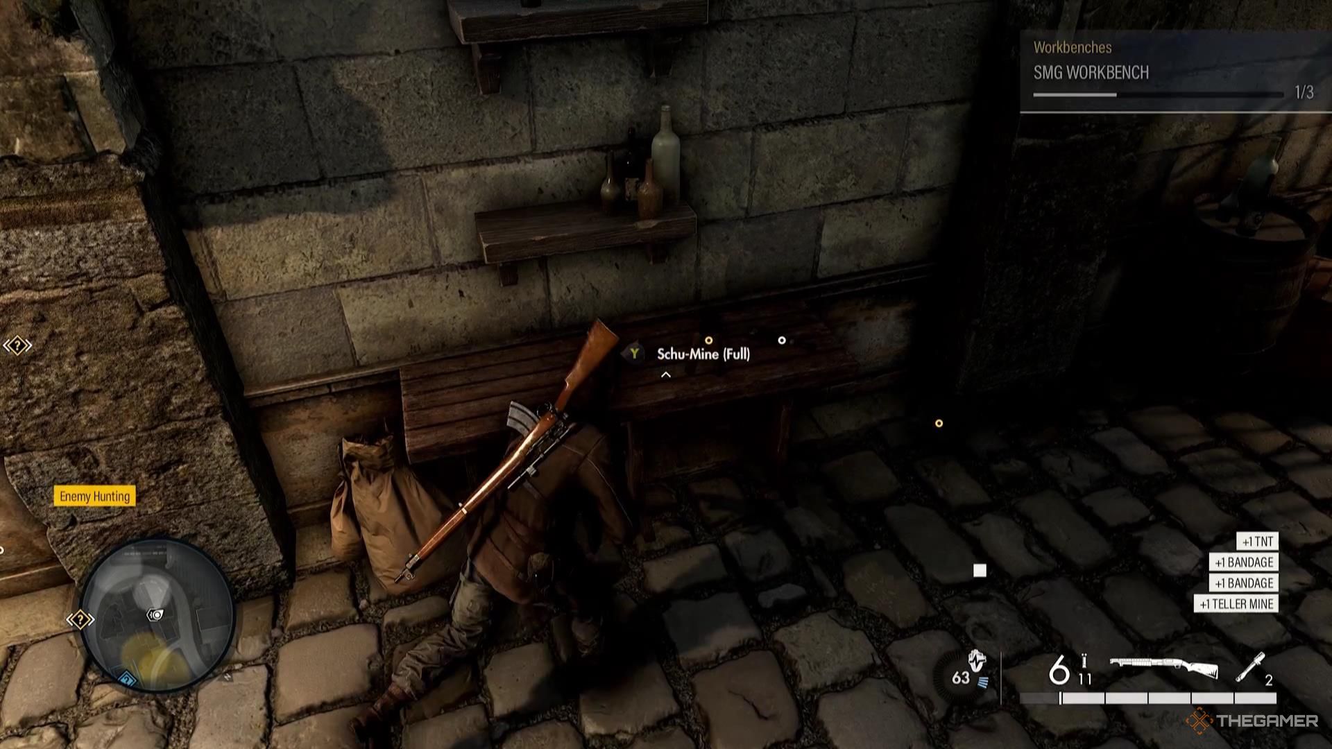 Harry finds a stash of items, including traps, on a wooden bench in Sniper Elite Resistance.