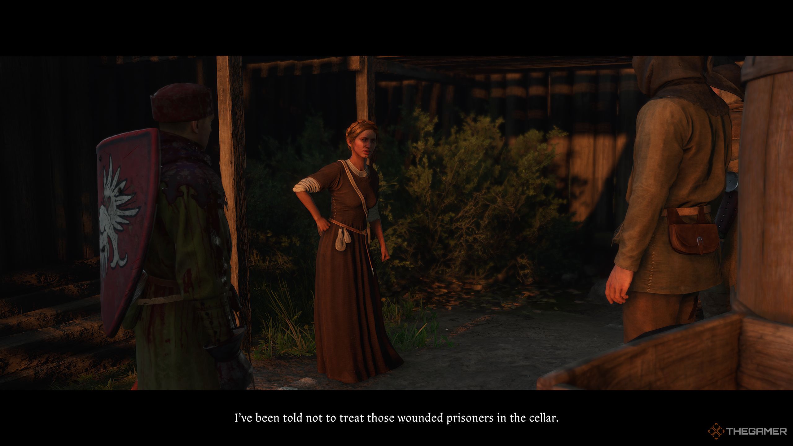 Henry helping Klara who is arguing with two guards.