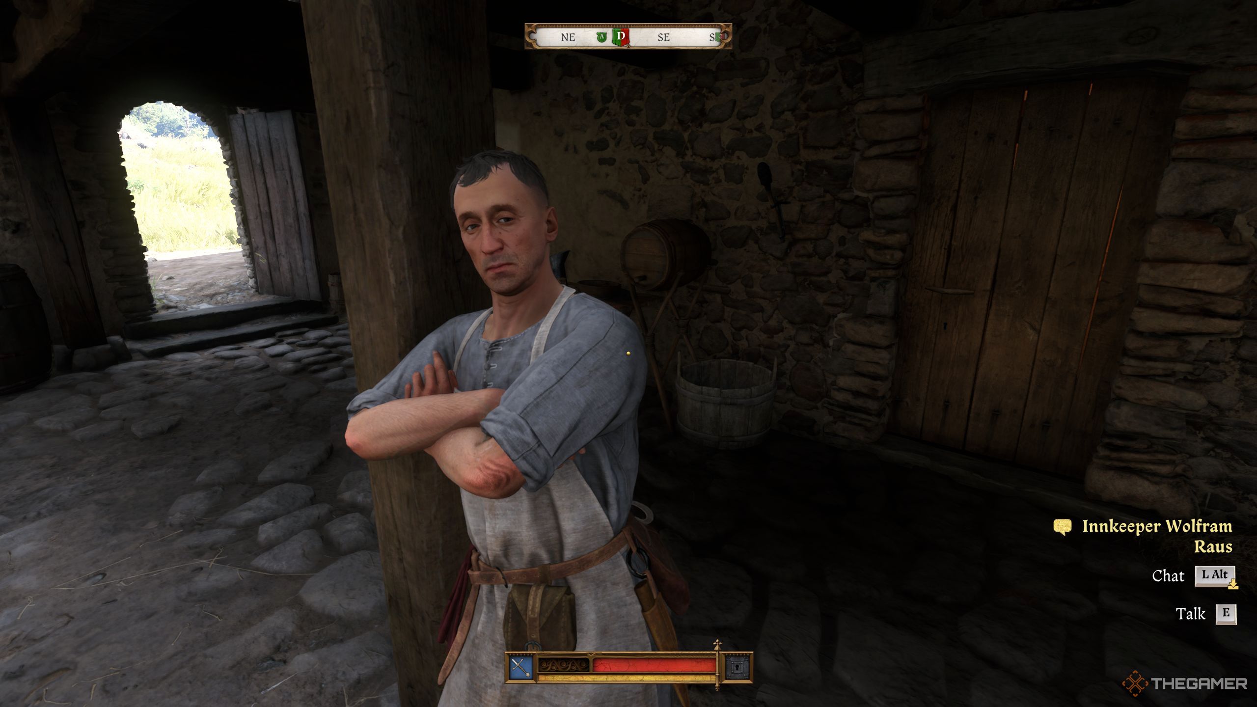 Henry standing in front of Innkeeper Wolfram Raus.