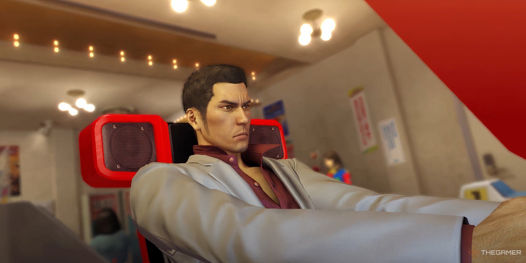 Kazuma Kiryu playing an arcade racing game in Yakuza 0.