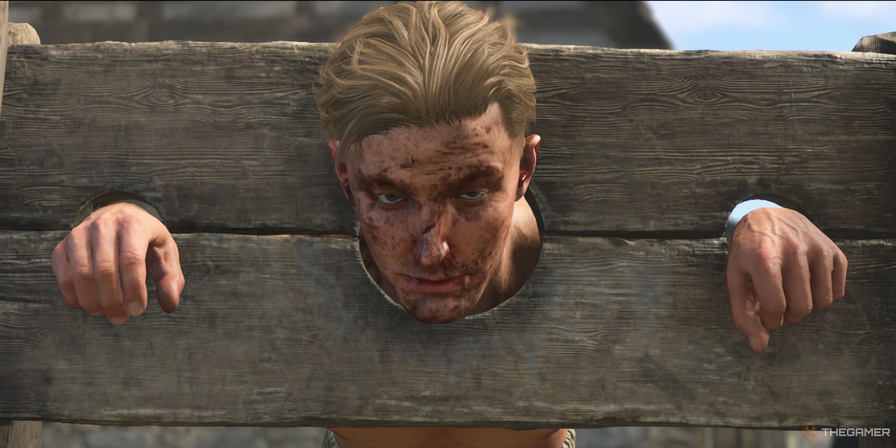 Hans is in some stocks and his face is covered in blood. 