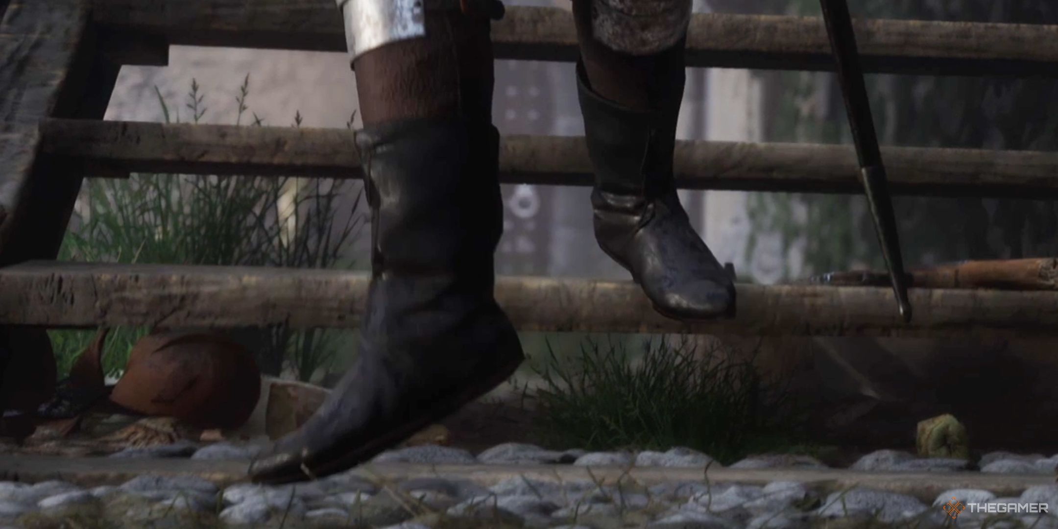 Kingdom Come Deliverance 2 screenshot of boots walking down wooden stairs.