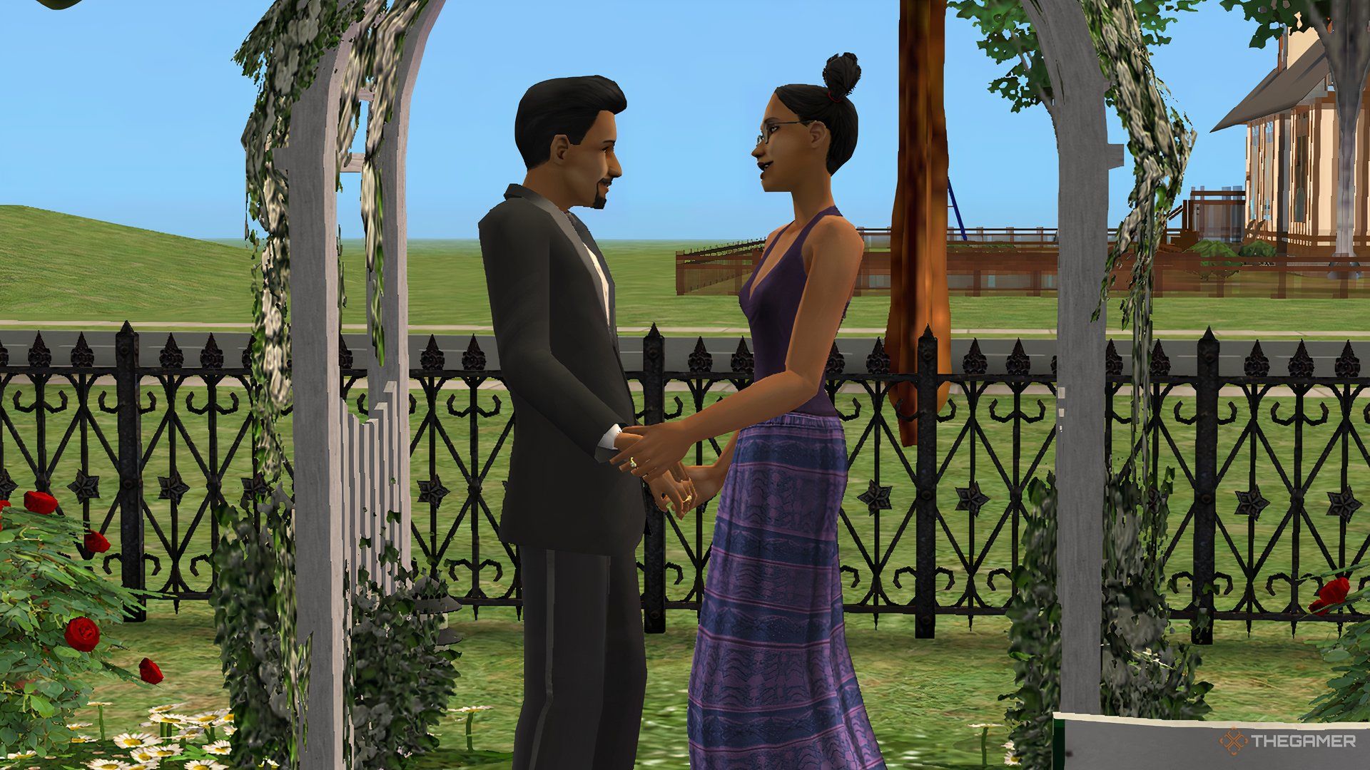 Sims 2 Don Lothario با Cassandra Goth در زیر یک قوس گلدار عاشقانه دست در دست داشت.
