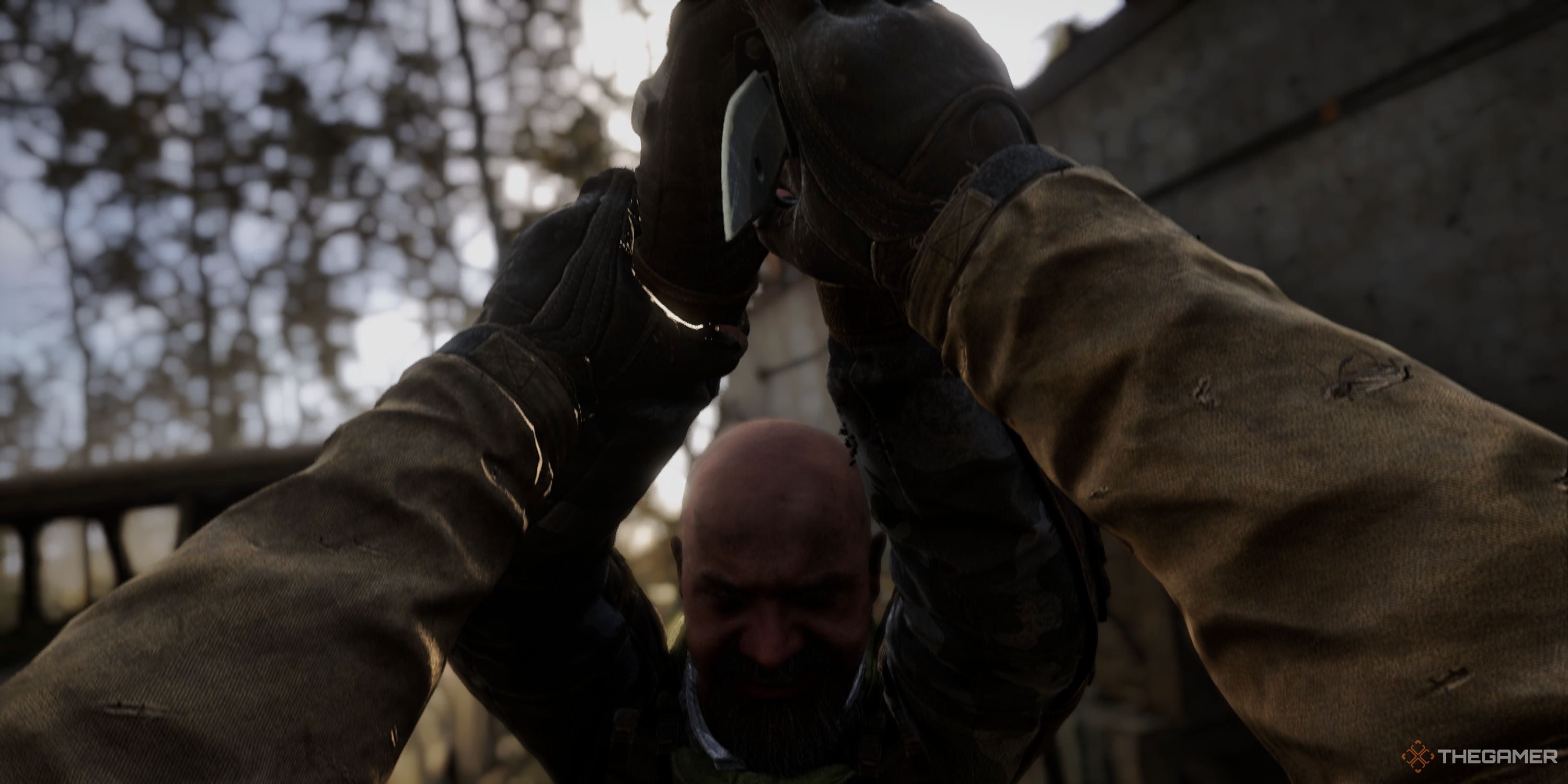 A bald Ward soldier trying to stab Skif.