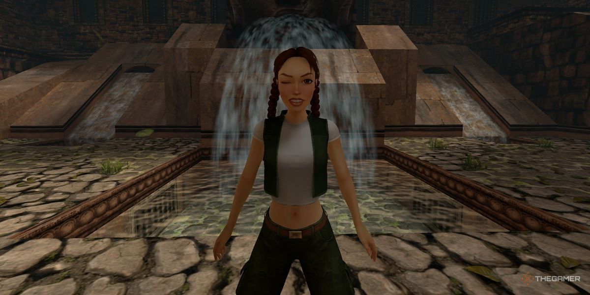 Lara Croft winks at the screen in the Cambodia level of Tomb Raider 4.