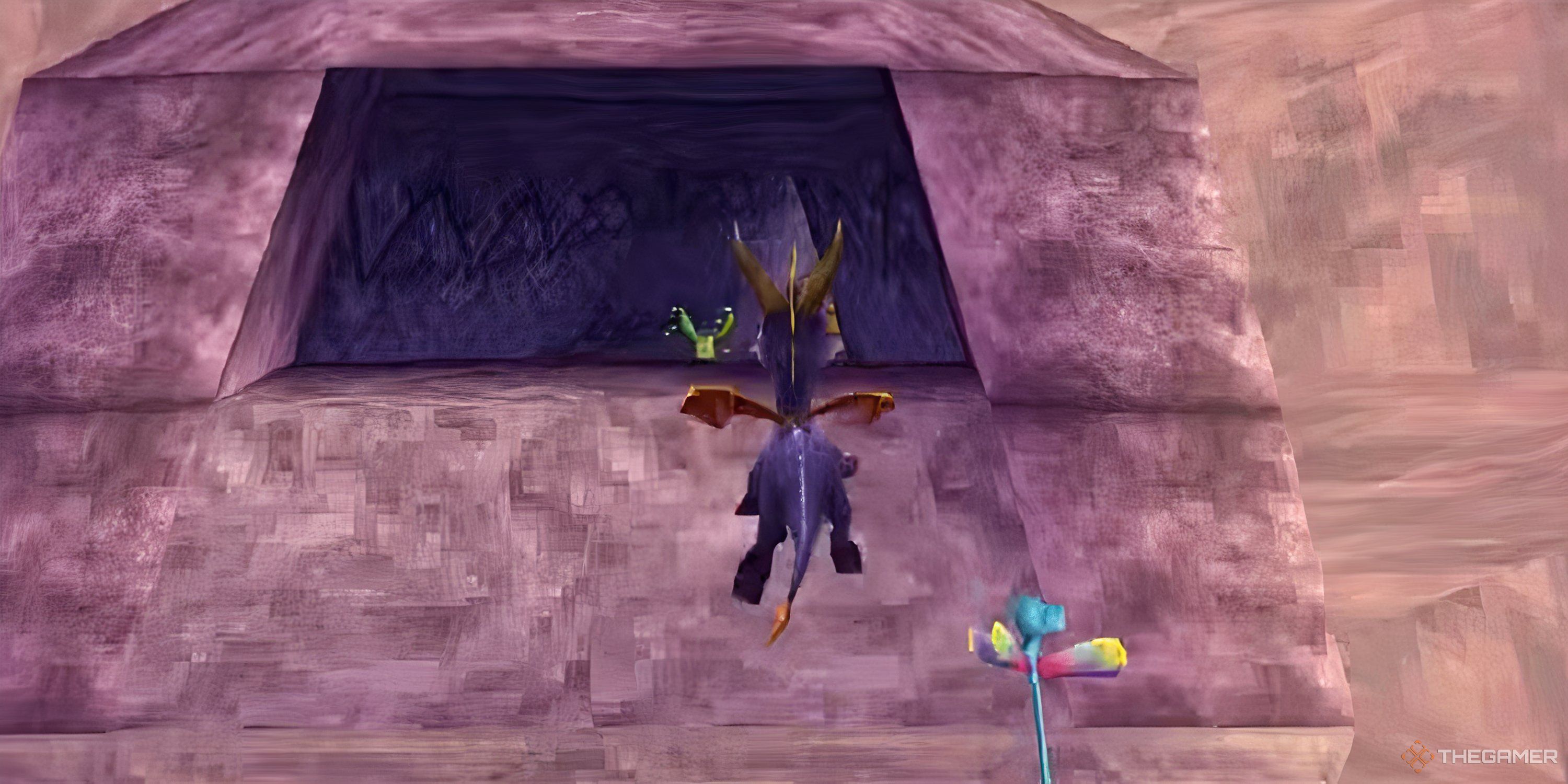 A gameplay screenshot of Spyro the Dragon for the PS1, showing the titular purple dragon flying into a cave.