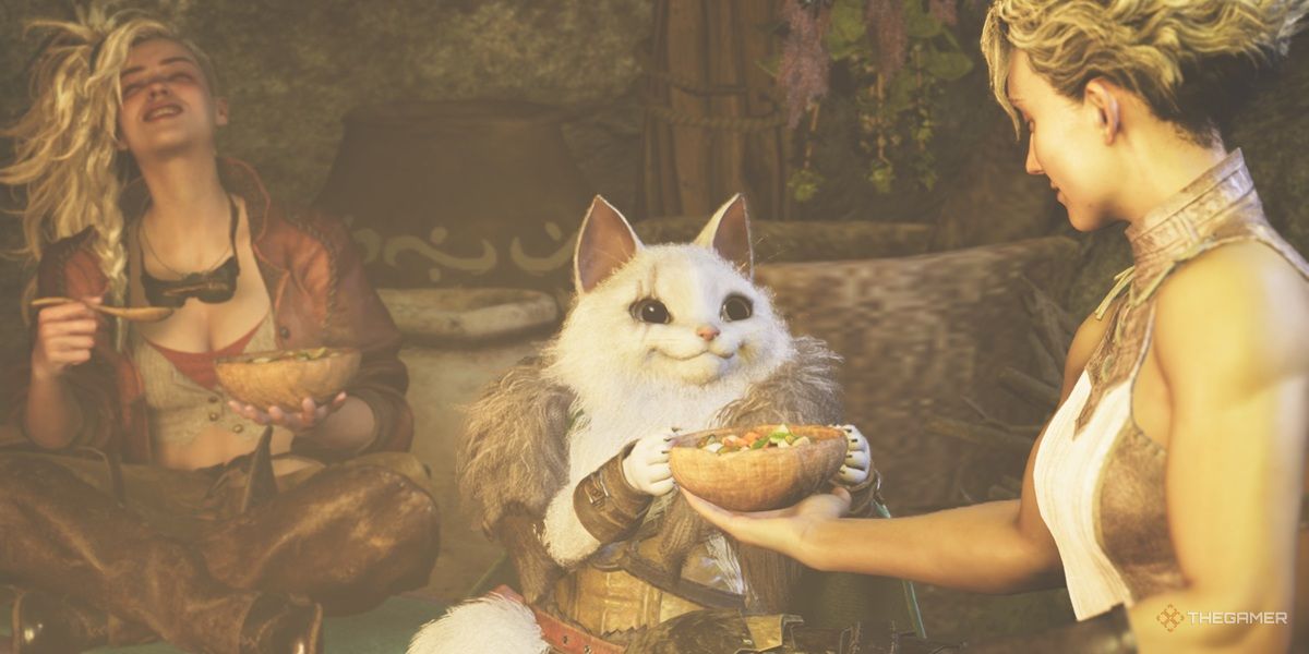 A Palico takes food from Olivia in Monster Hunter Wilds while Gemma laughs.