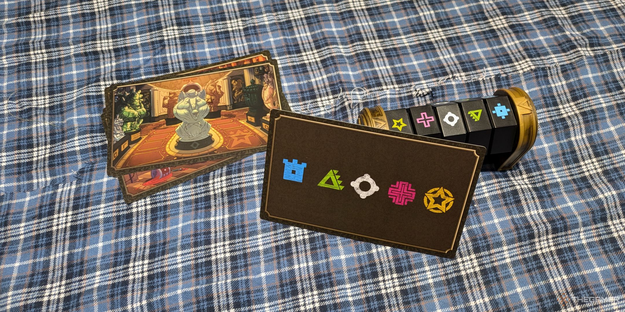 A photo of the front and back of a scene card, leaning against the codex in Five Minute Mystery.