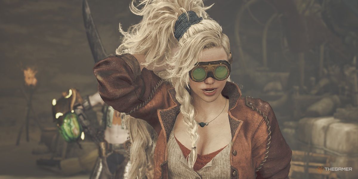 Gemma puts on her goggles while talking in Monster Hunter Wilds.