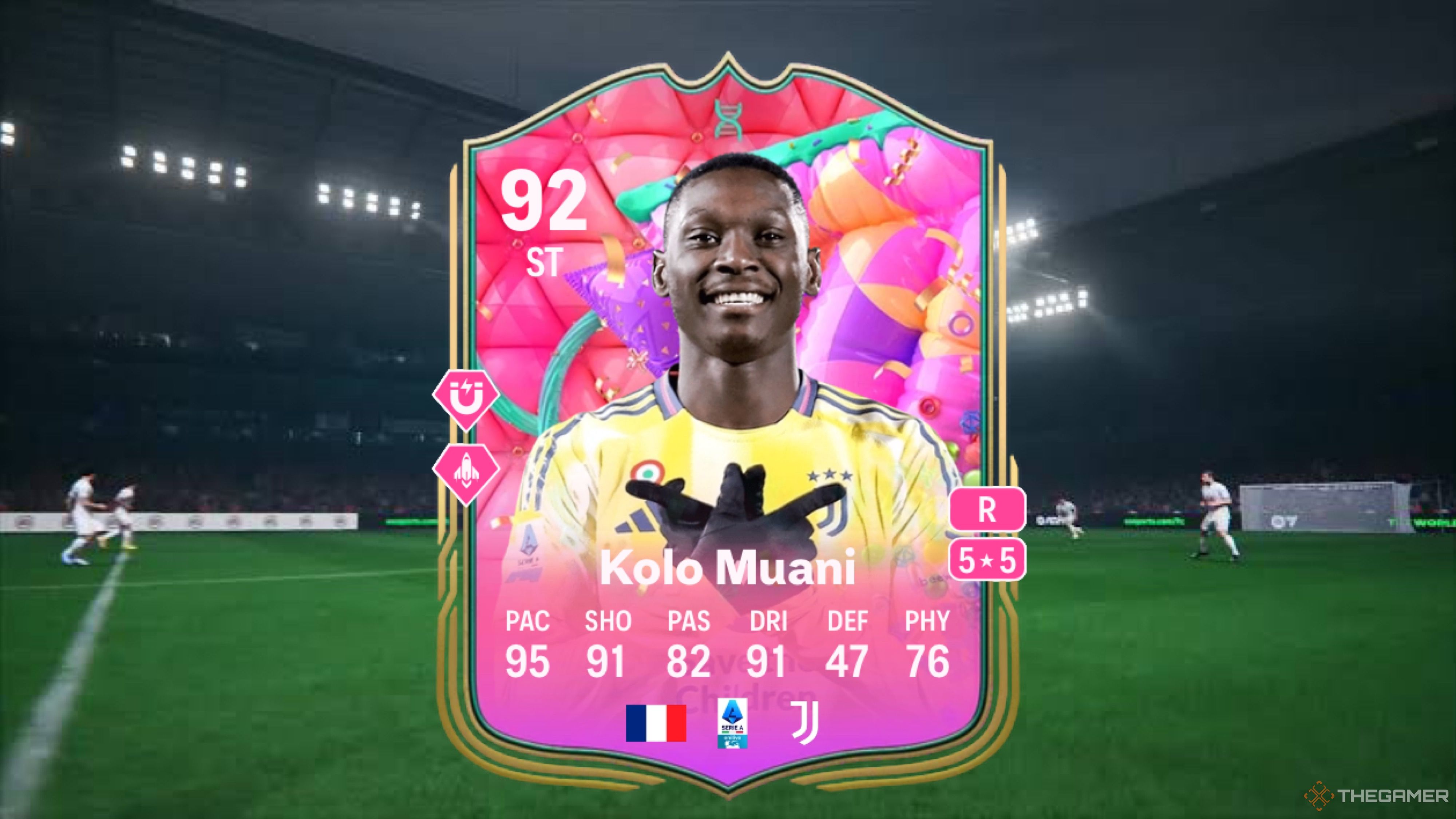 Image showing Kolo Muani card against a faded pitch background.