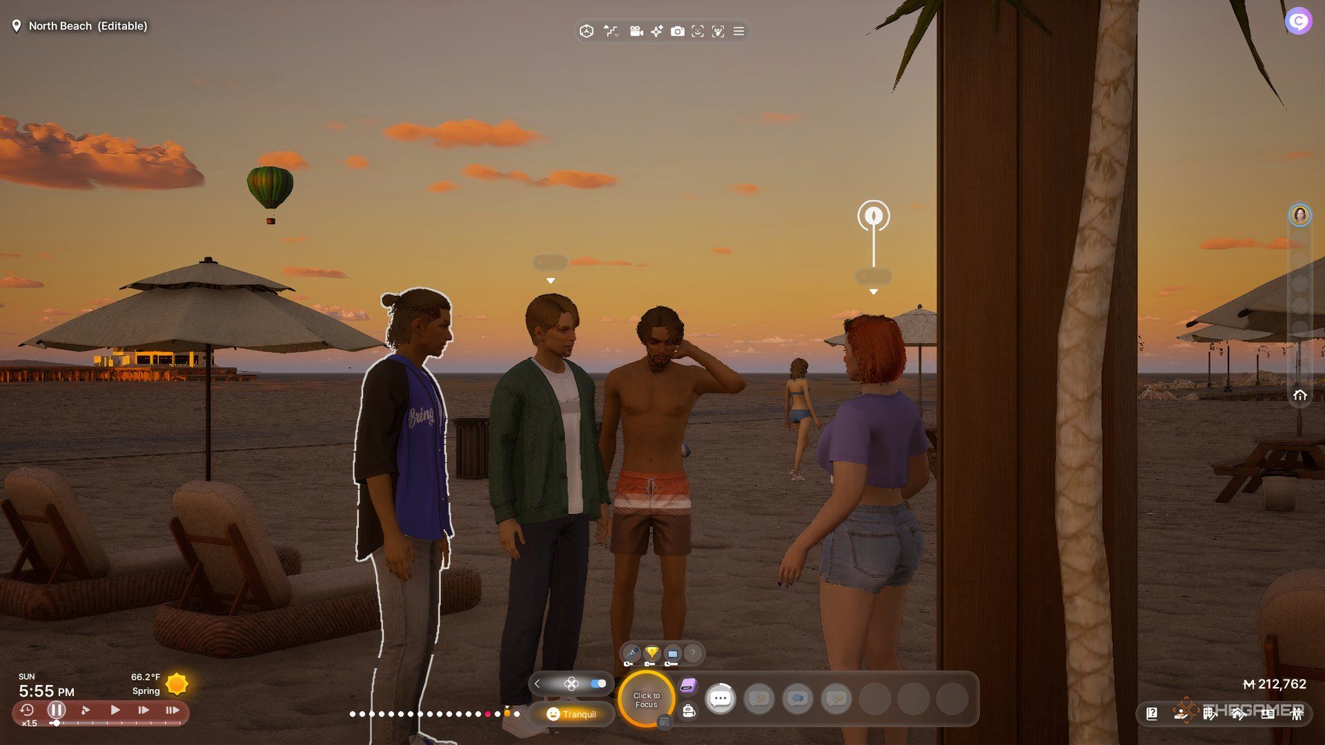 A Zoi chatting with three men on the beach.