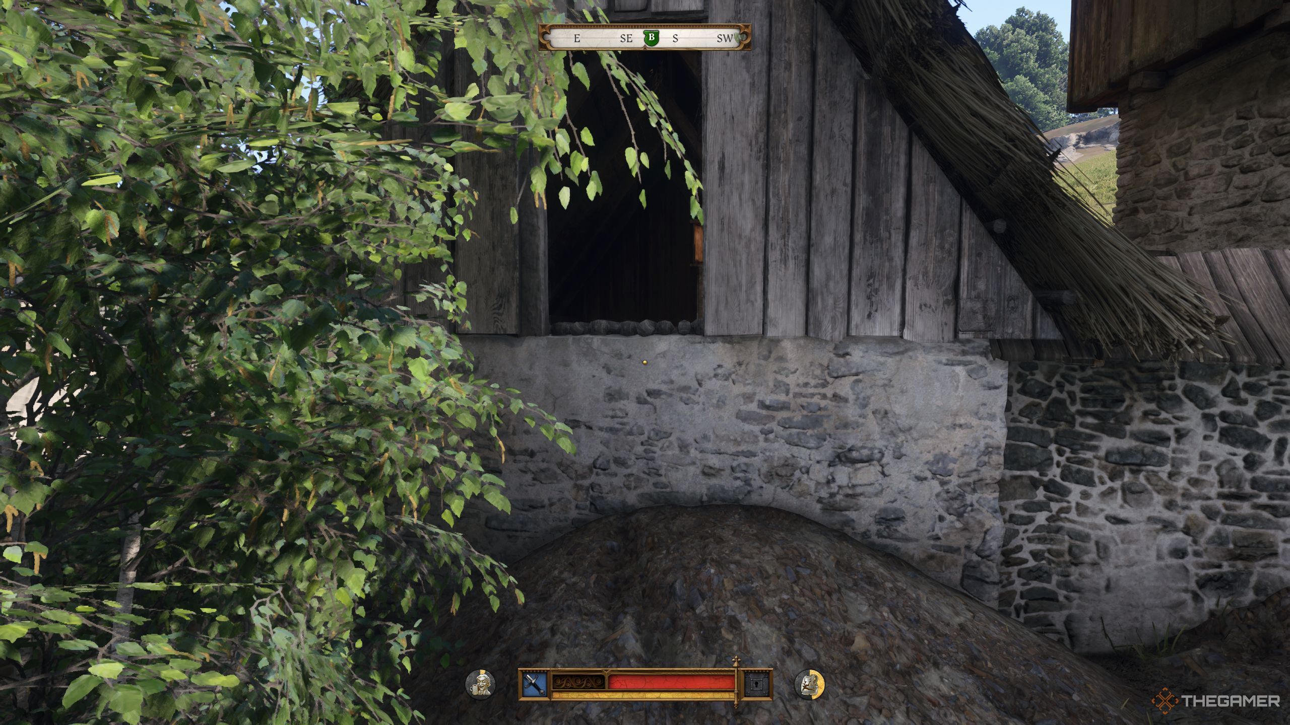 Henry standing in front of an open window In Kingdom Come: Deliverance 2.