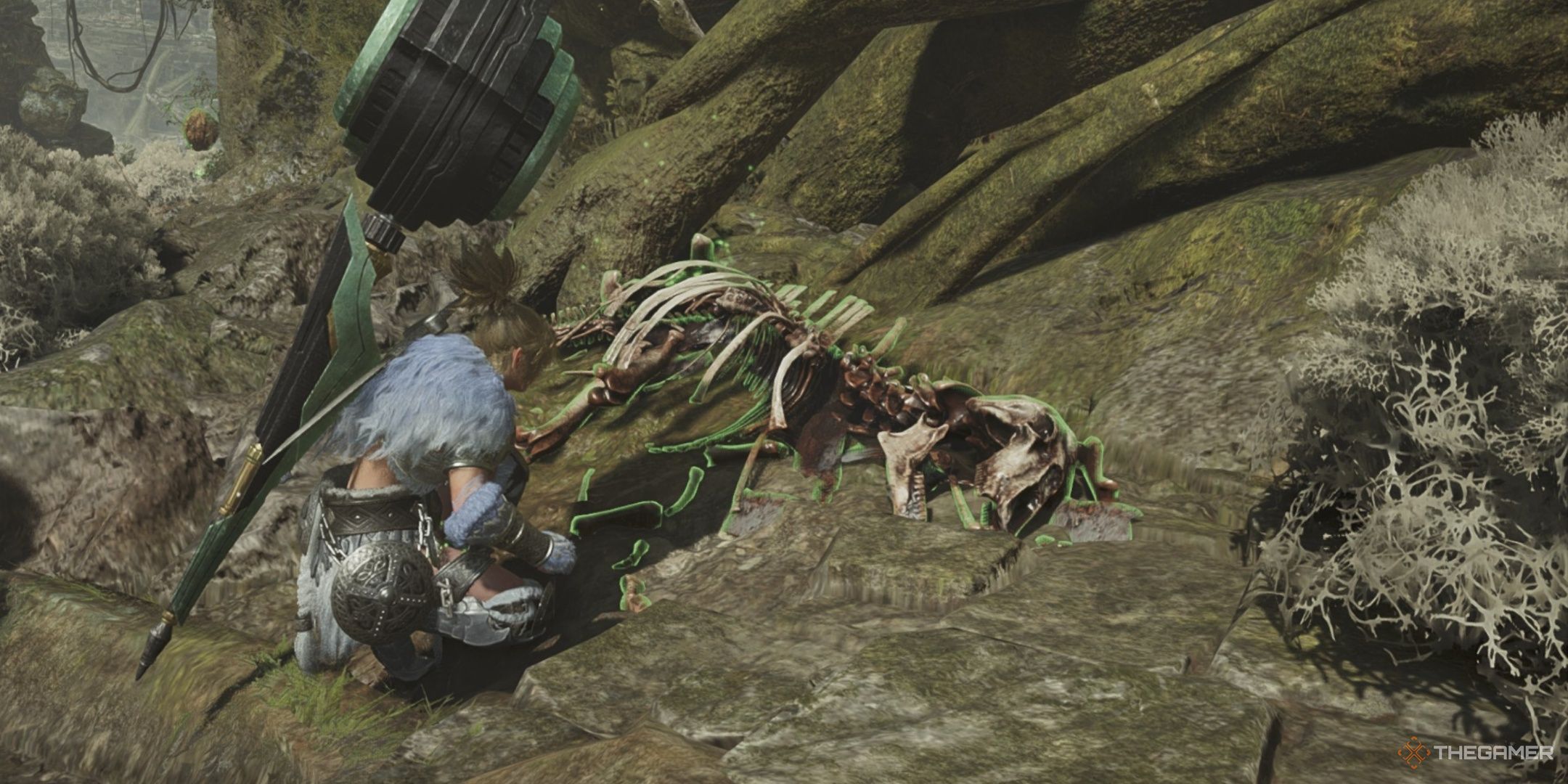 A hunter in the arkveld set crouching beside a pile of bones in monster hunter wilds.