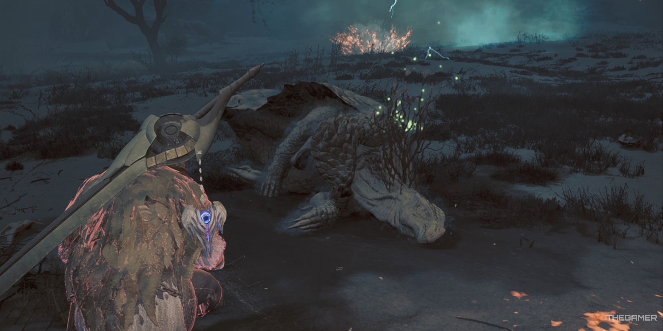 A hunter crouched beside a dead monster with Wyvernsprout growing on it in monster hunter wilds.