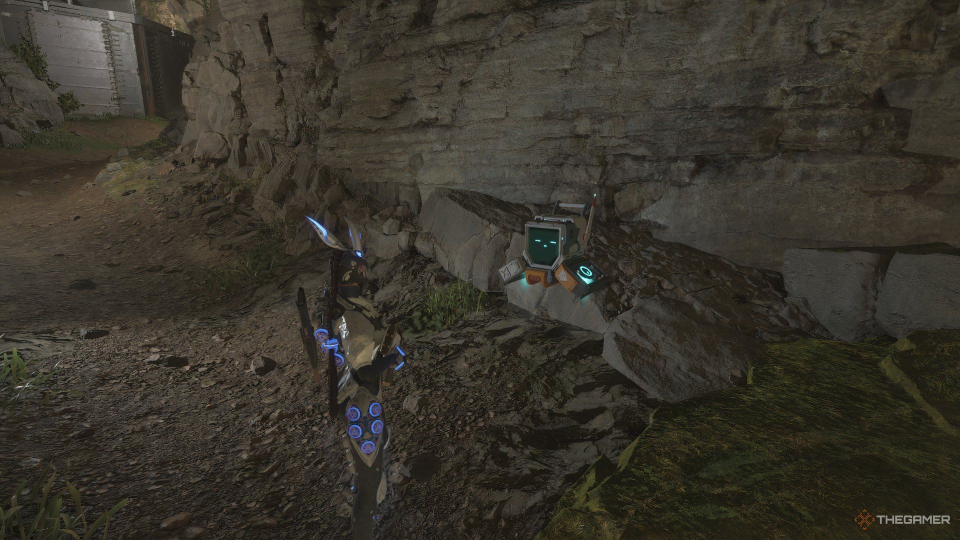 The First Descendant Bunny interacting with an computer NPC against a rock wall.