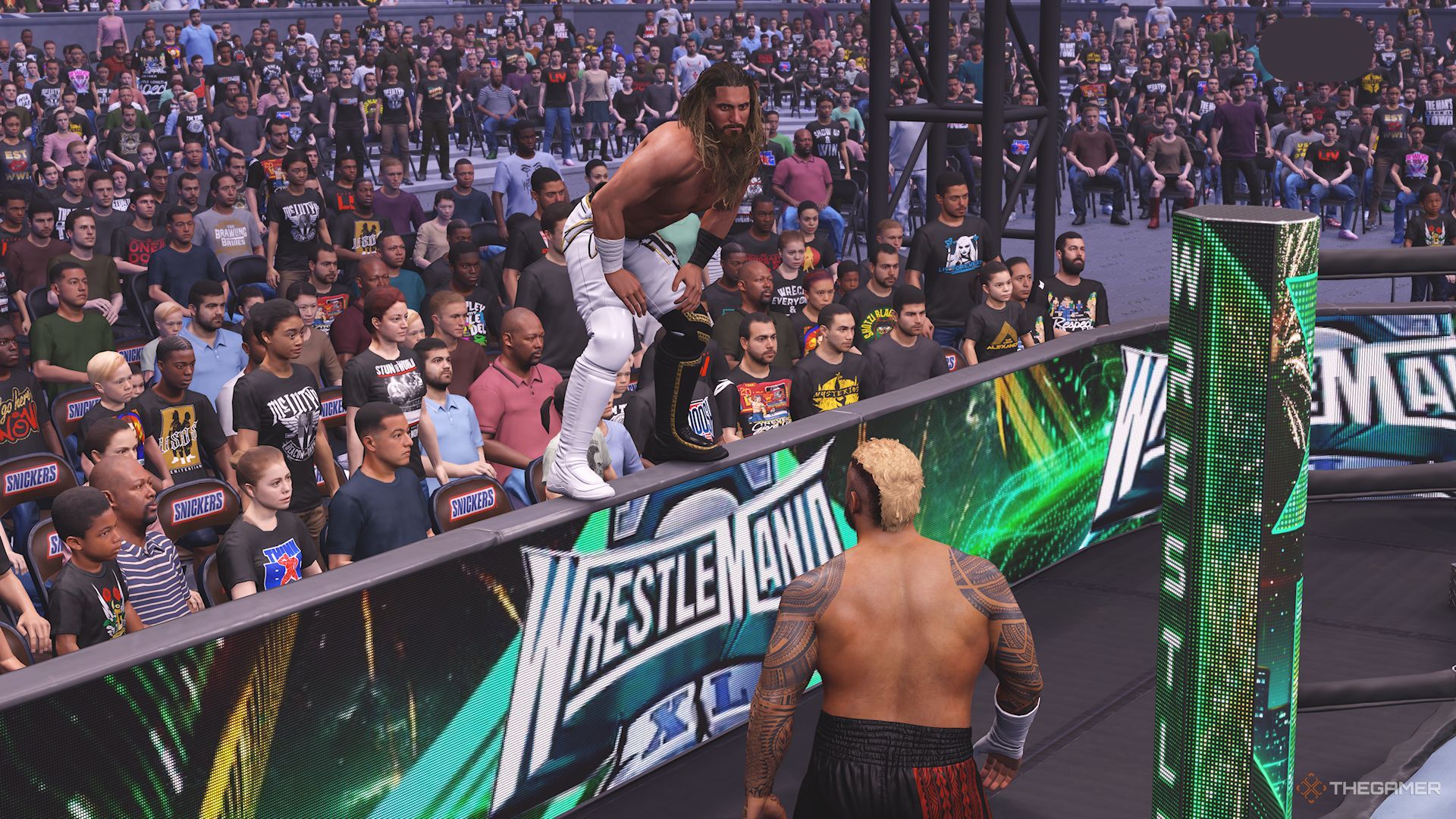 WWE 2K25 screenshot of Seth Rollins about to jump off a barricade onto Solo Sikoa.