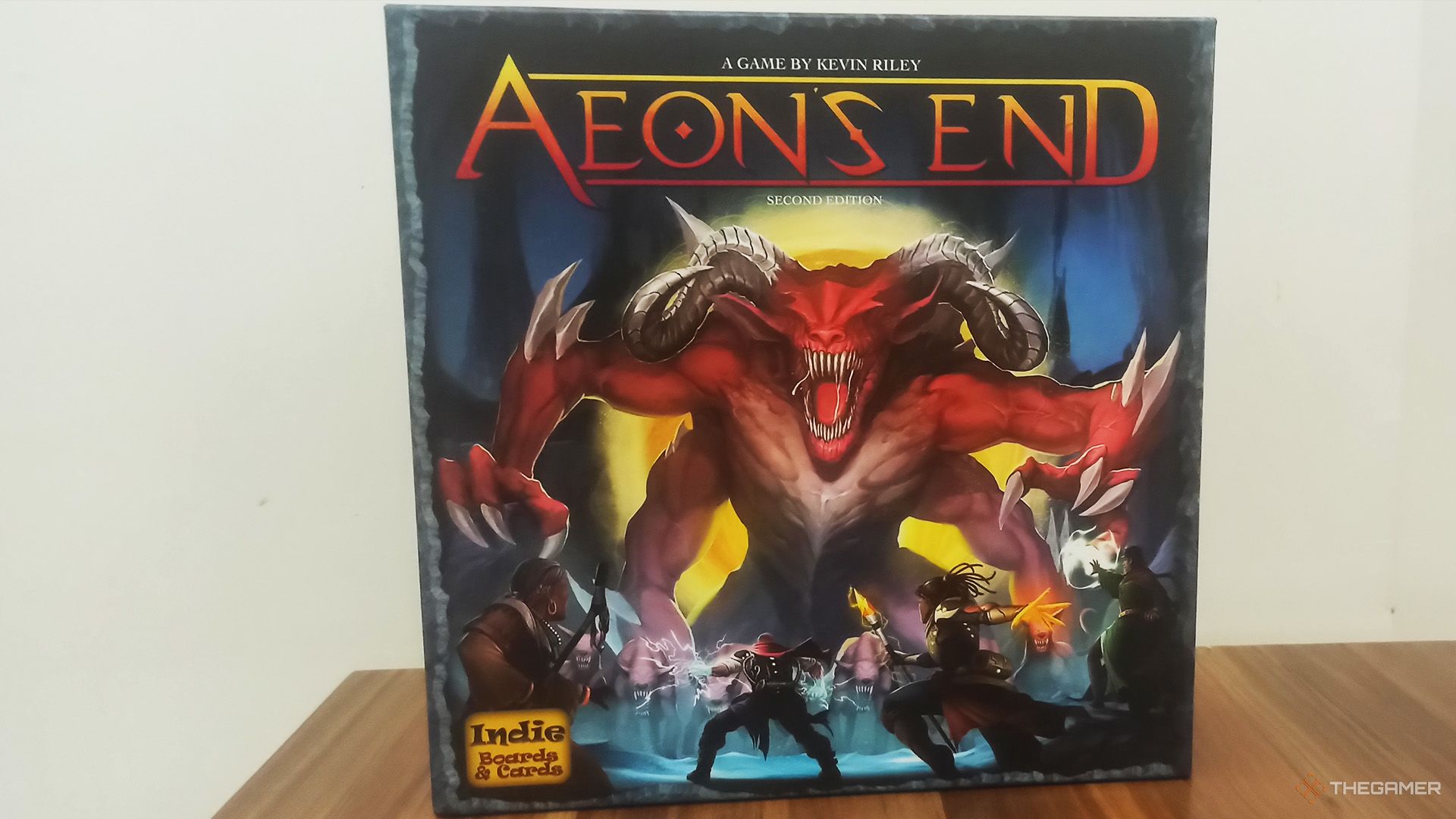 Aeon's End's box on a wooden table.